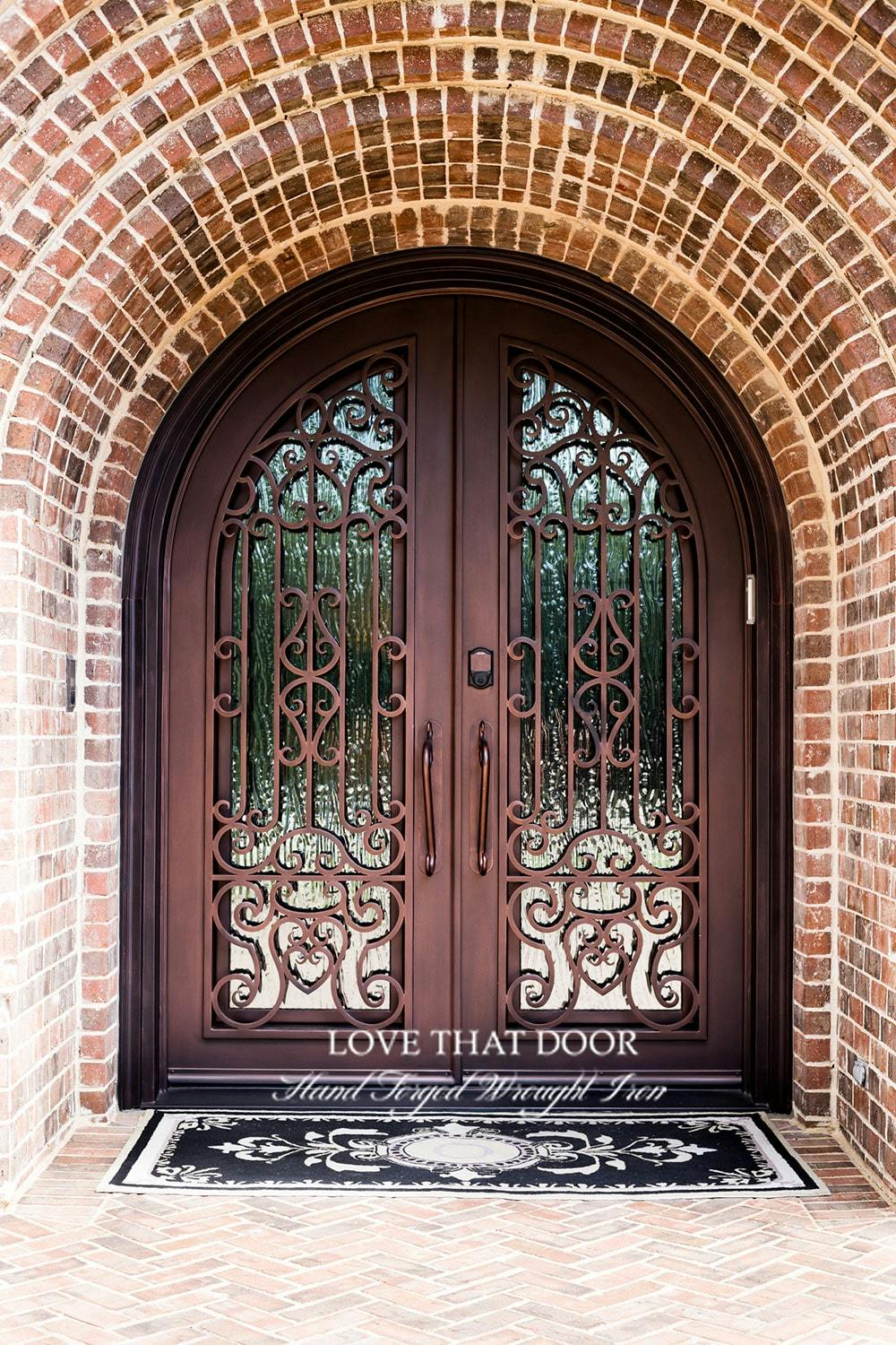 Stylish iron double doors with intricate metalwork and glass panels