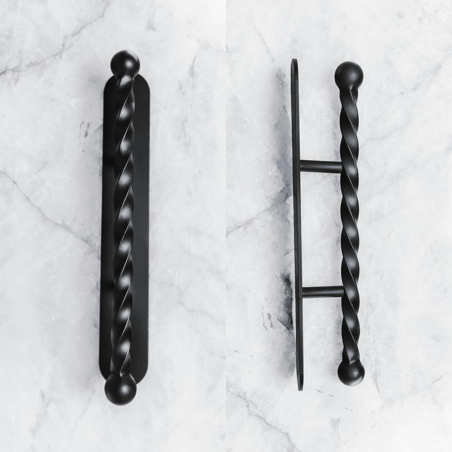 Iron door handle with intricate patterns and artistic details