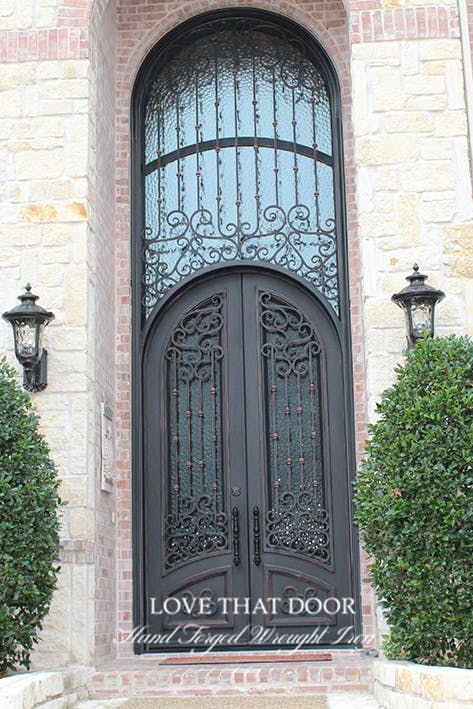 Regal iron door and transom design, enhancing the architectural appeal of your property.