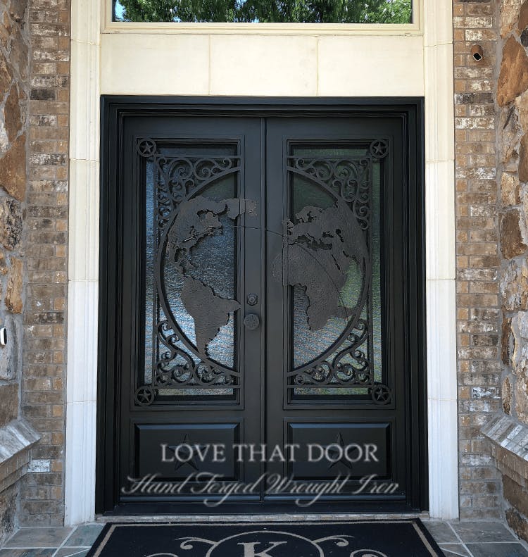 Iron double doors with intricate artistic details and expert craftsmanship
