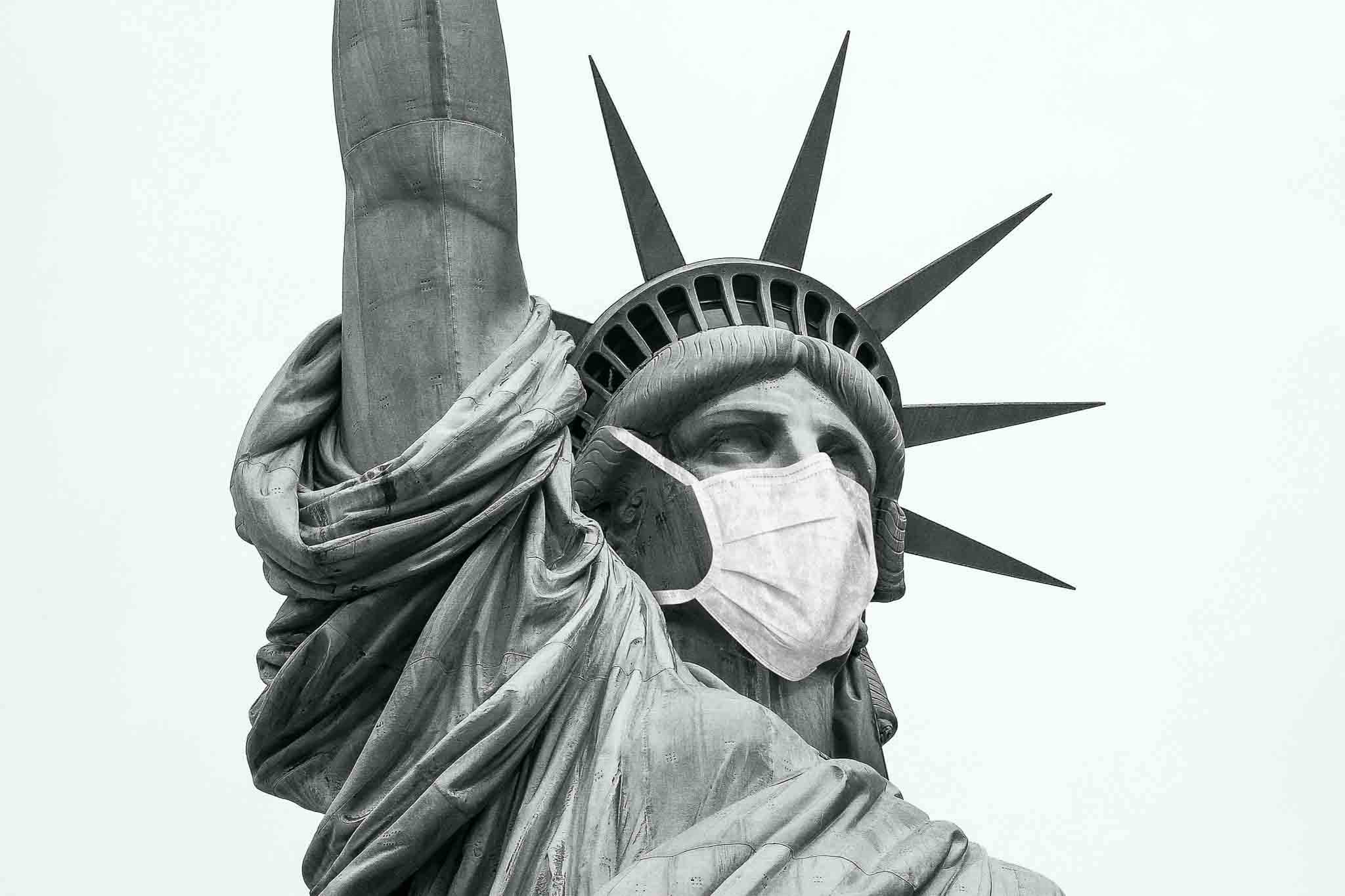 The Statue of Liberty with a mask on during Covid