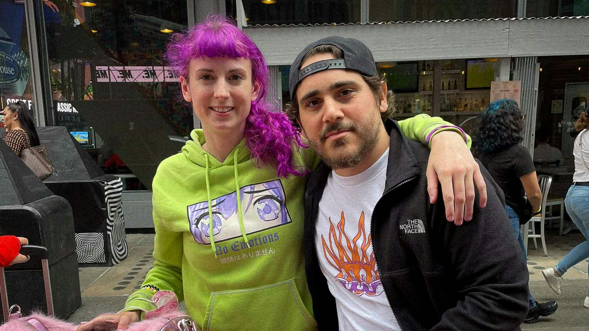 Bit Pixi taking a photo with a Louie C Rhymes at NFT NYC.