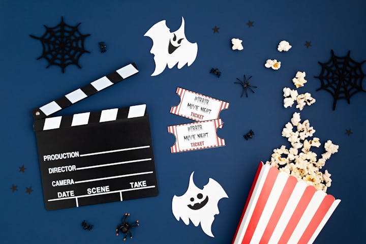 Movie clapperboard and halloween decoration. Horror movie night, halloween party invitation

