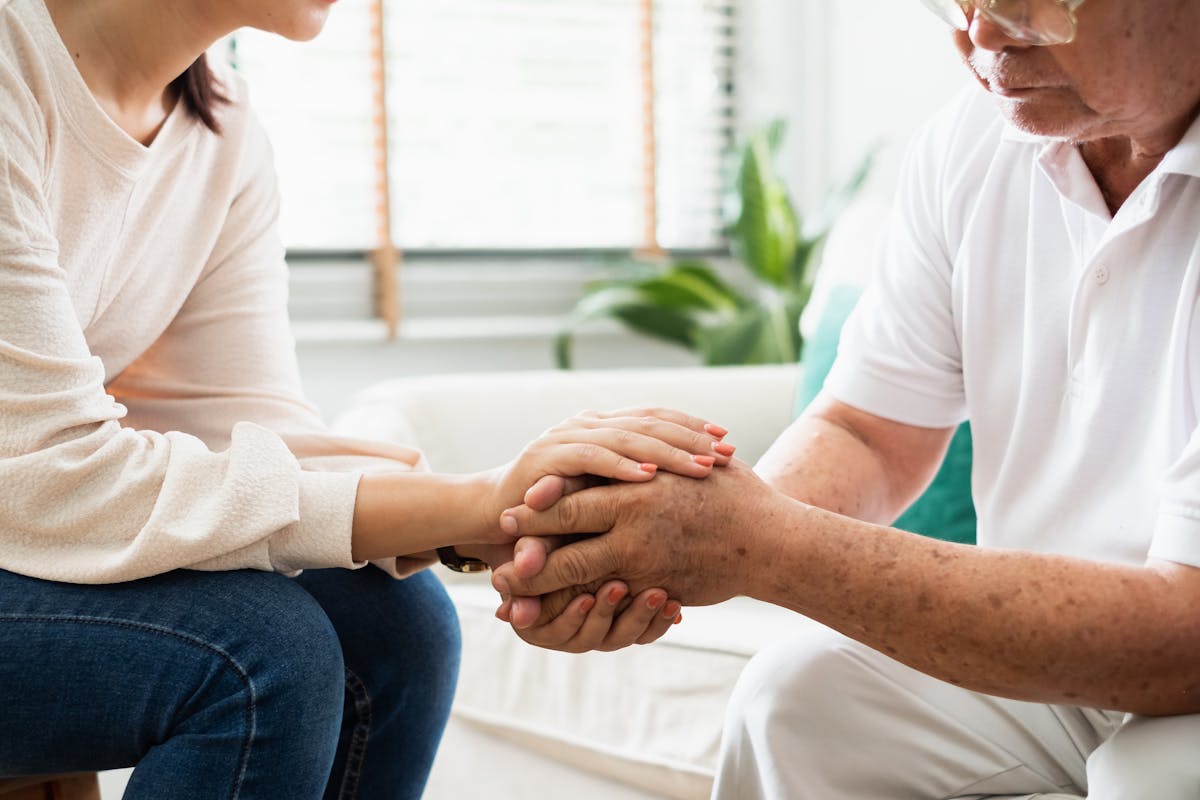 Caregiver psychologist console Asian senior people for mental health