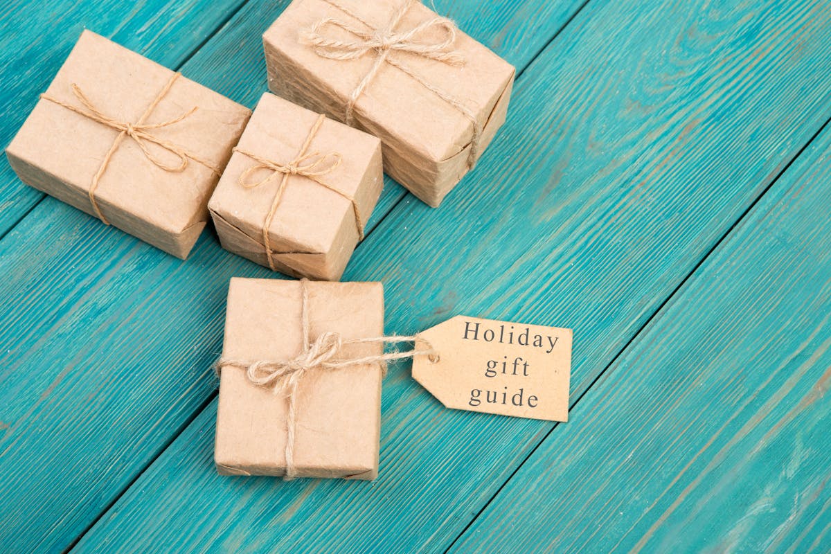 Gift boxes and tag with text "Holiday gift guide"