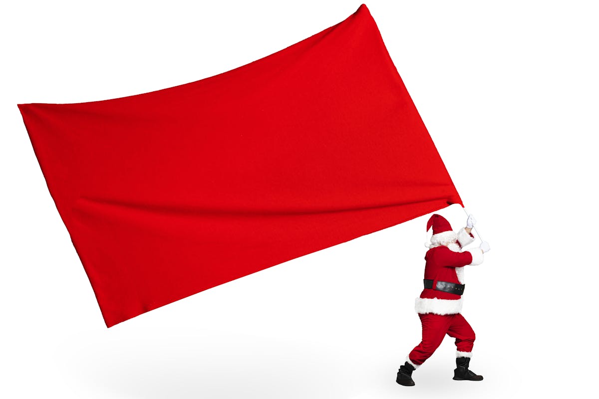 santa holding a red flag.