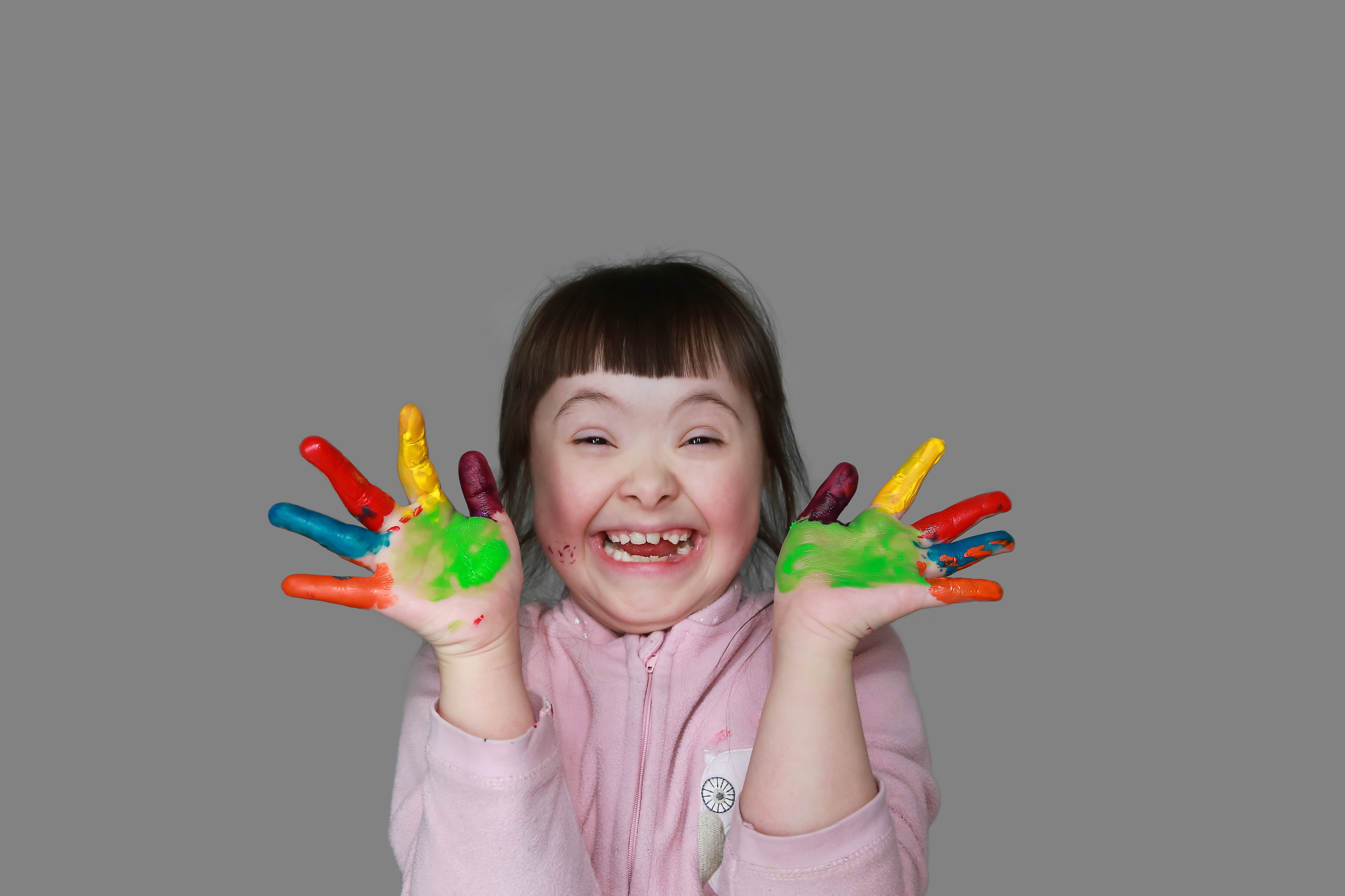 autism girl with hand painted hands