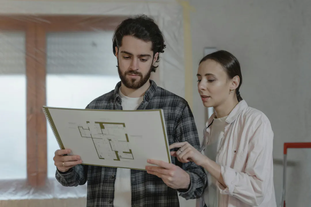 two people reviewing house designs