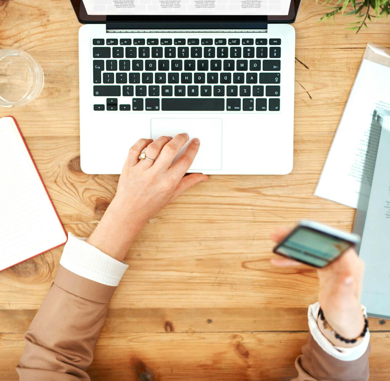Top view of business woman working on laptop