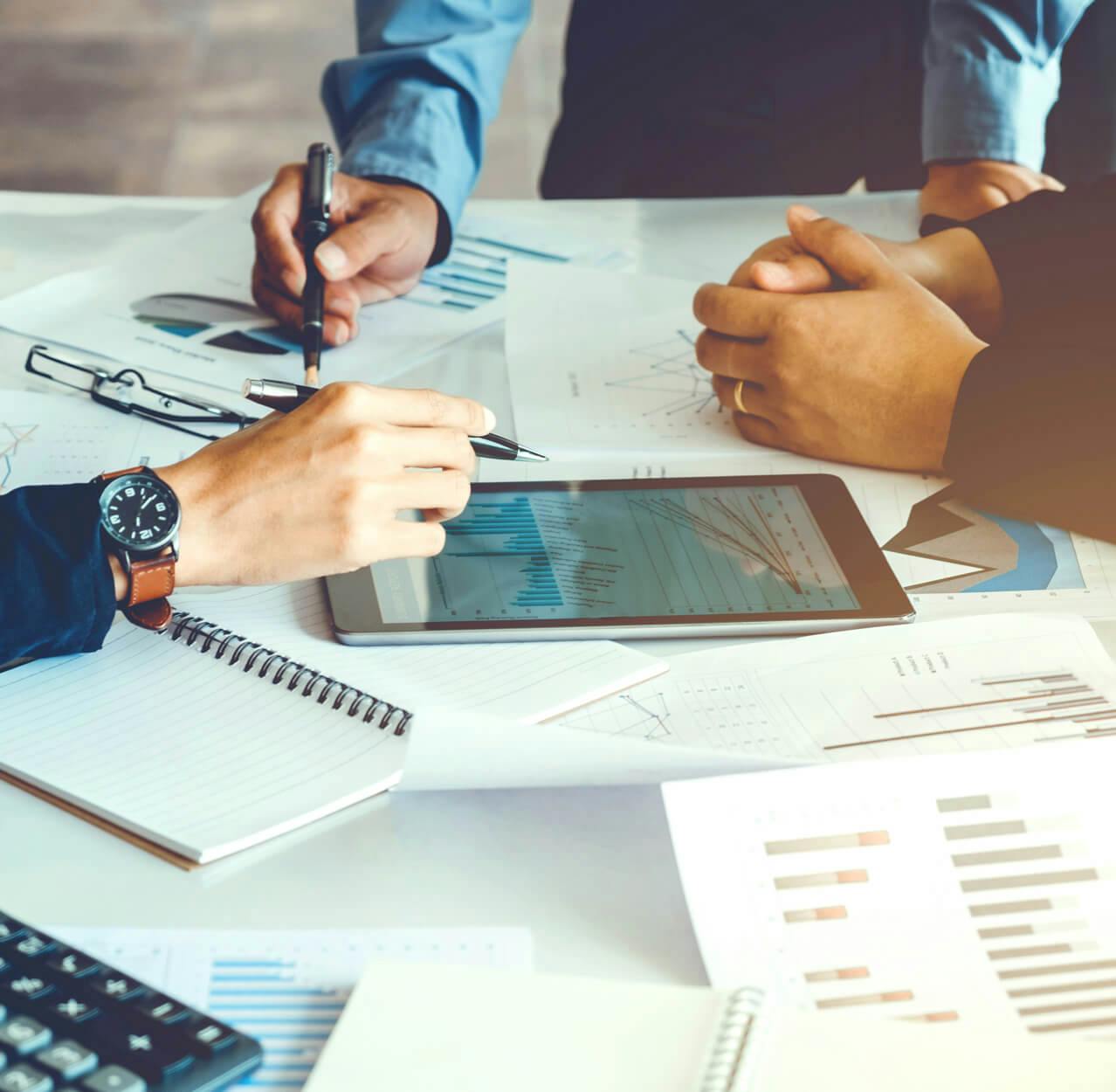 group of people analyzing financial documents