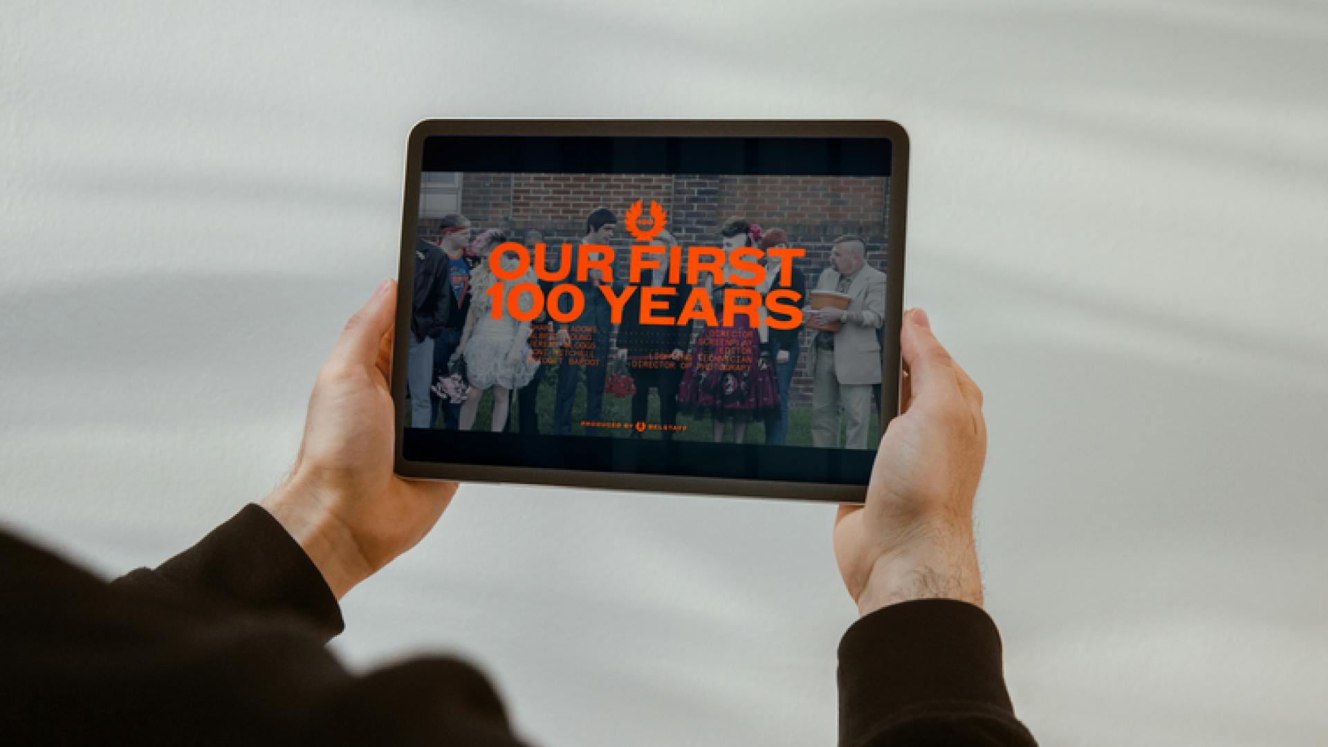 Belstaff man holding tablet