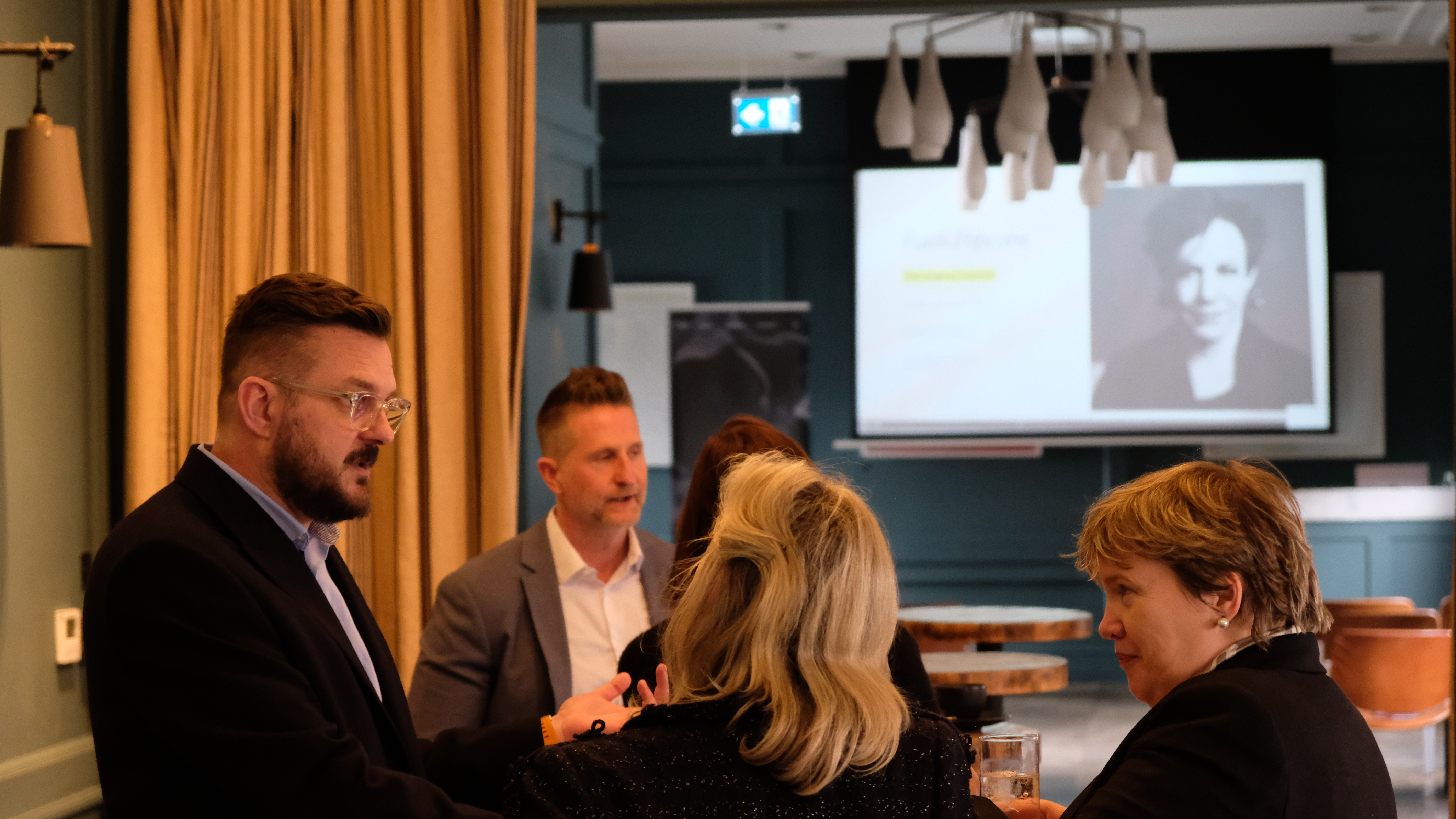 Professionals discussing future insights and digital innovation at a Lucky Beard event