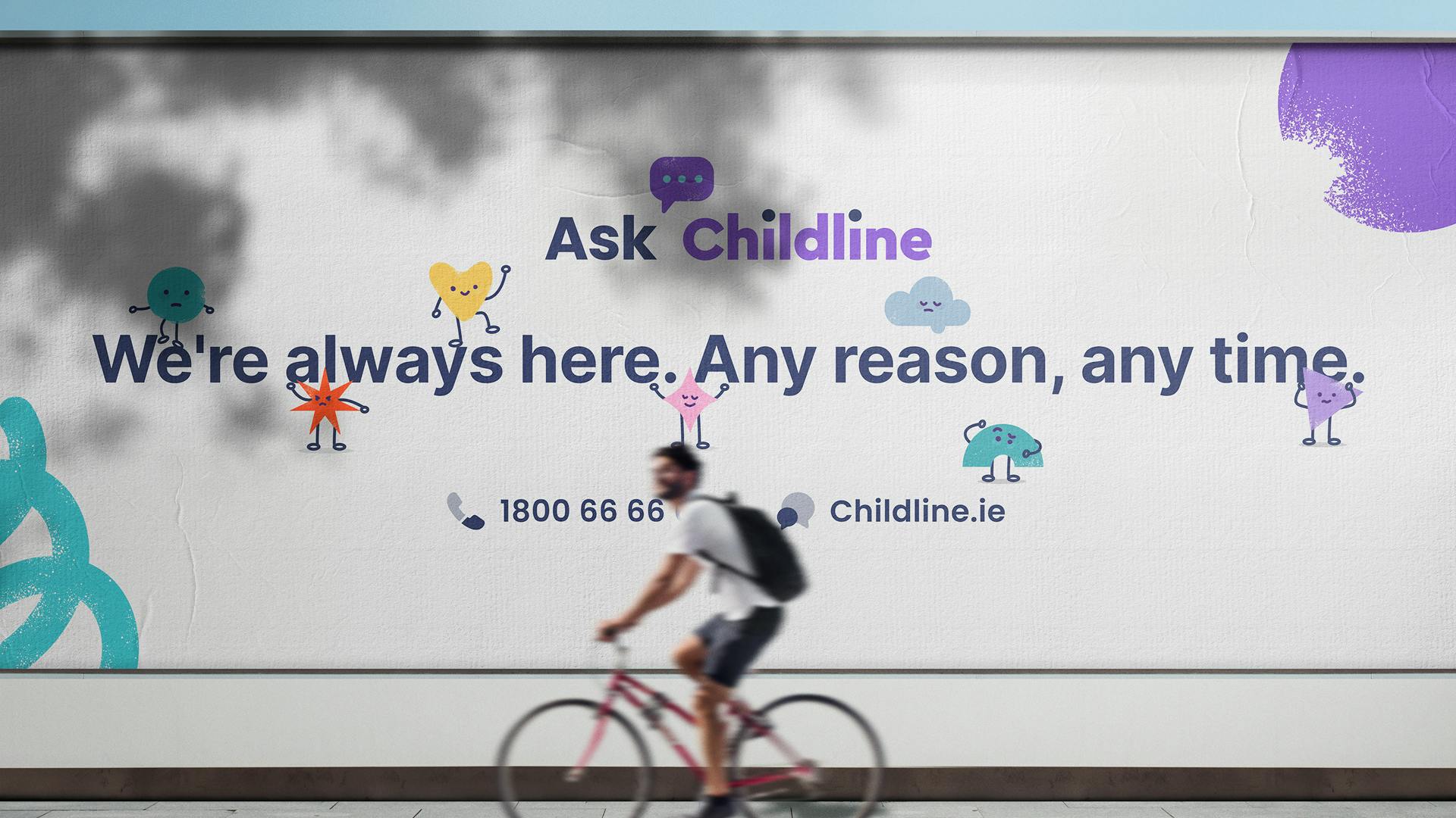 A man riding past a billboard showcasing the Childline help messaging