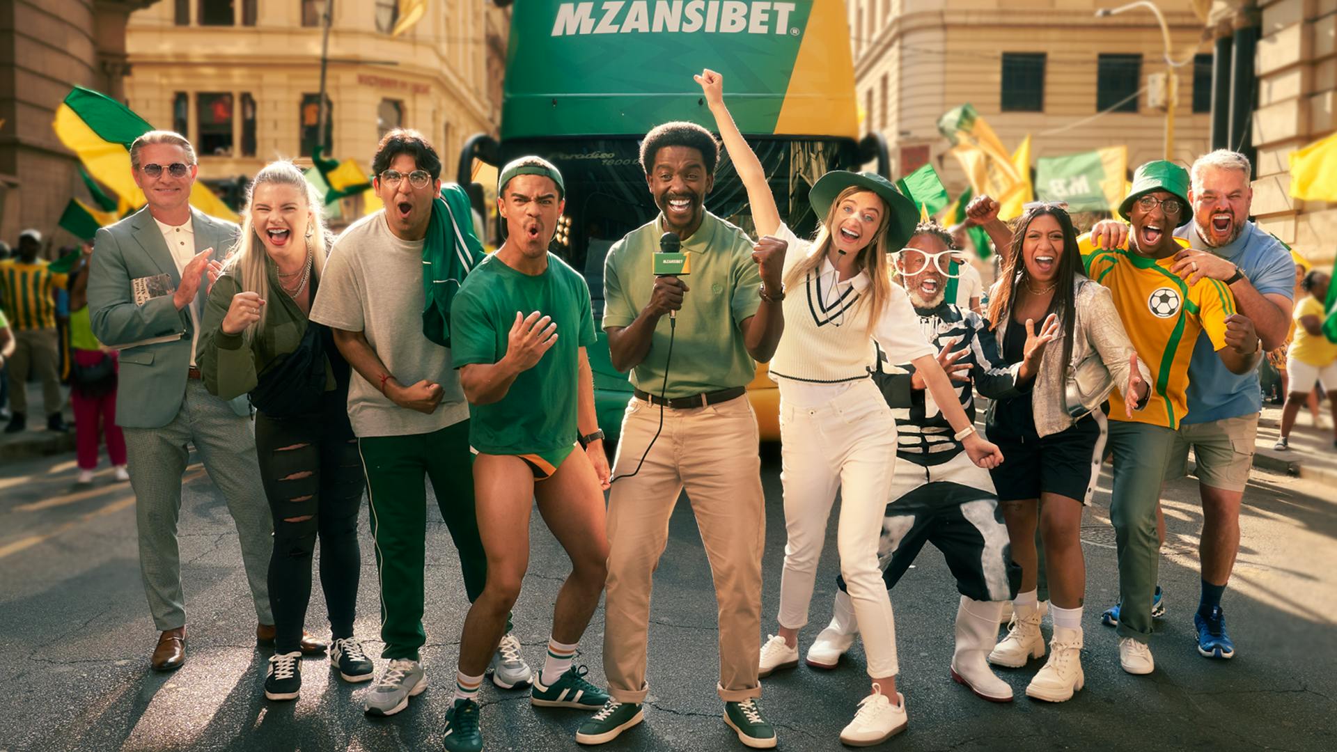A group of people celebrating and cheering
