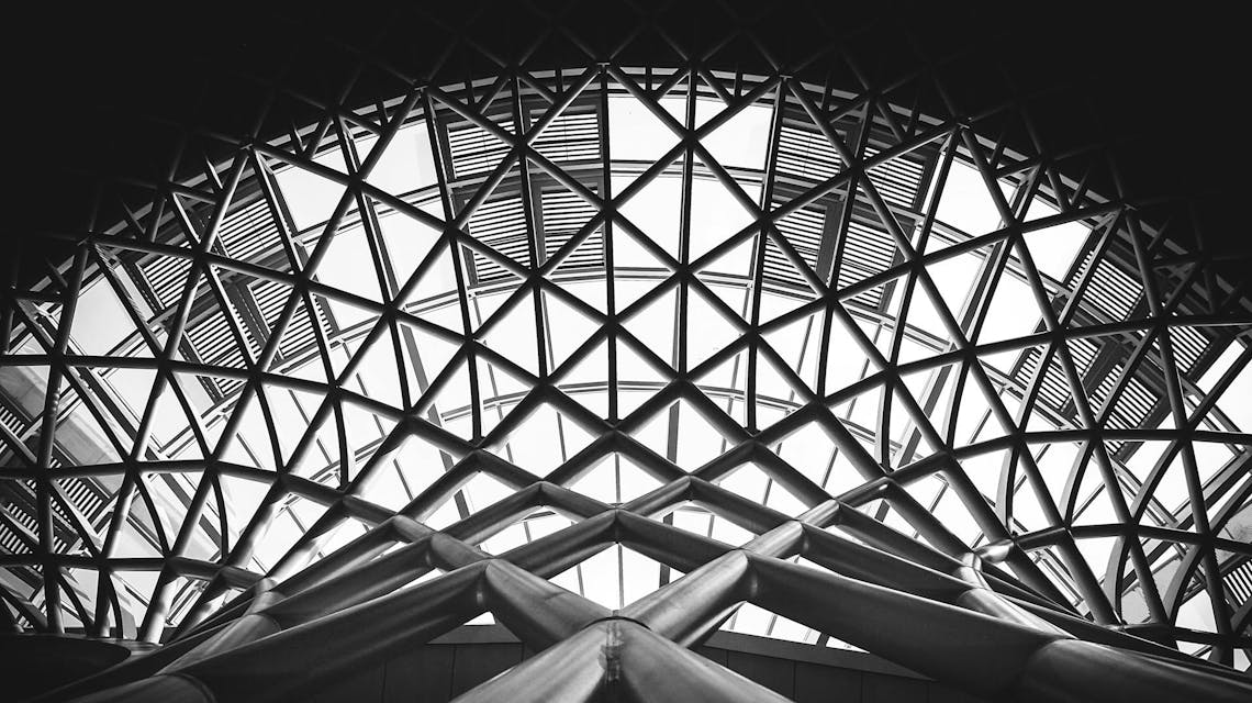 A photo of the underside of a stadium showing the supportive structure