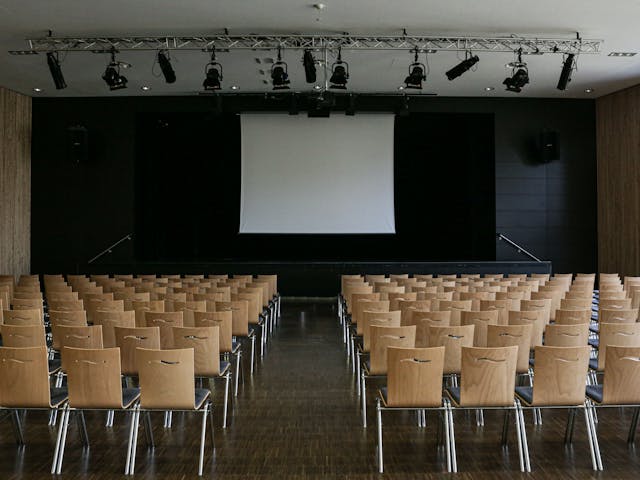 Community building with chairs facing a stage