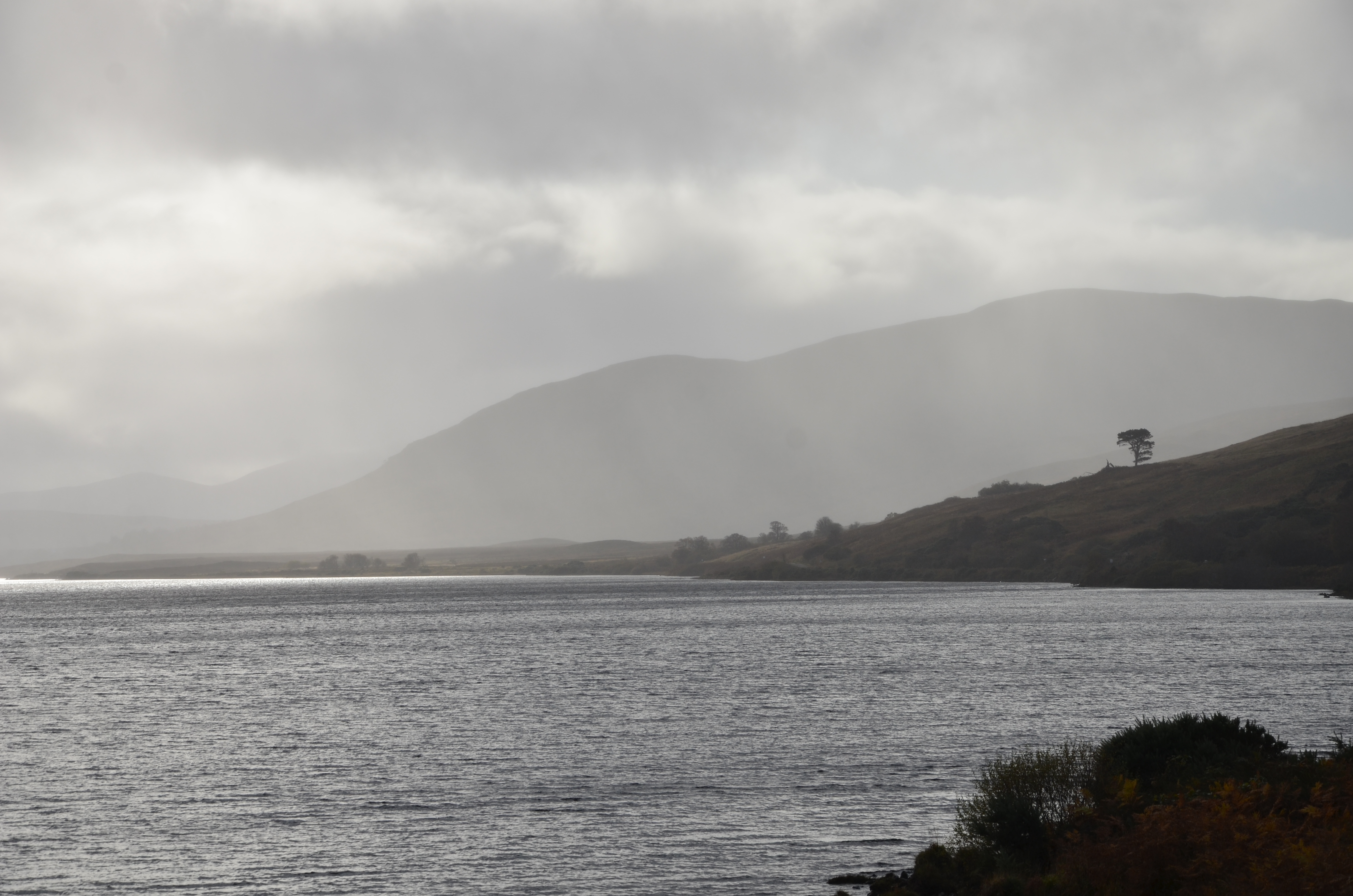 View of water with hills in the background