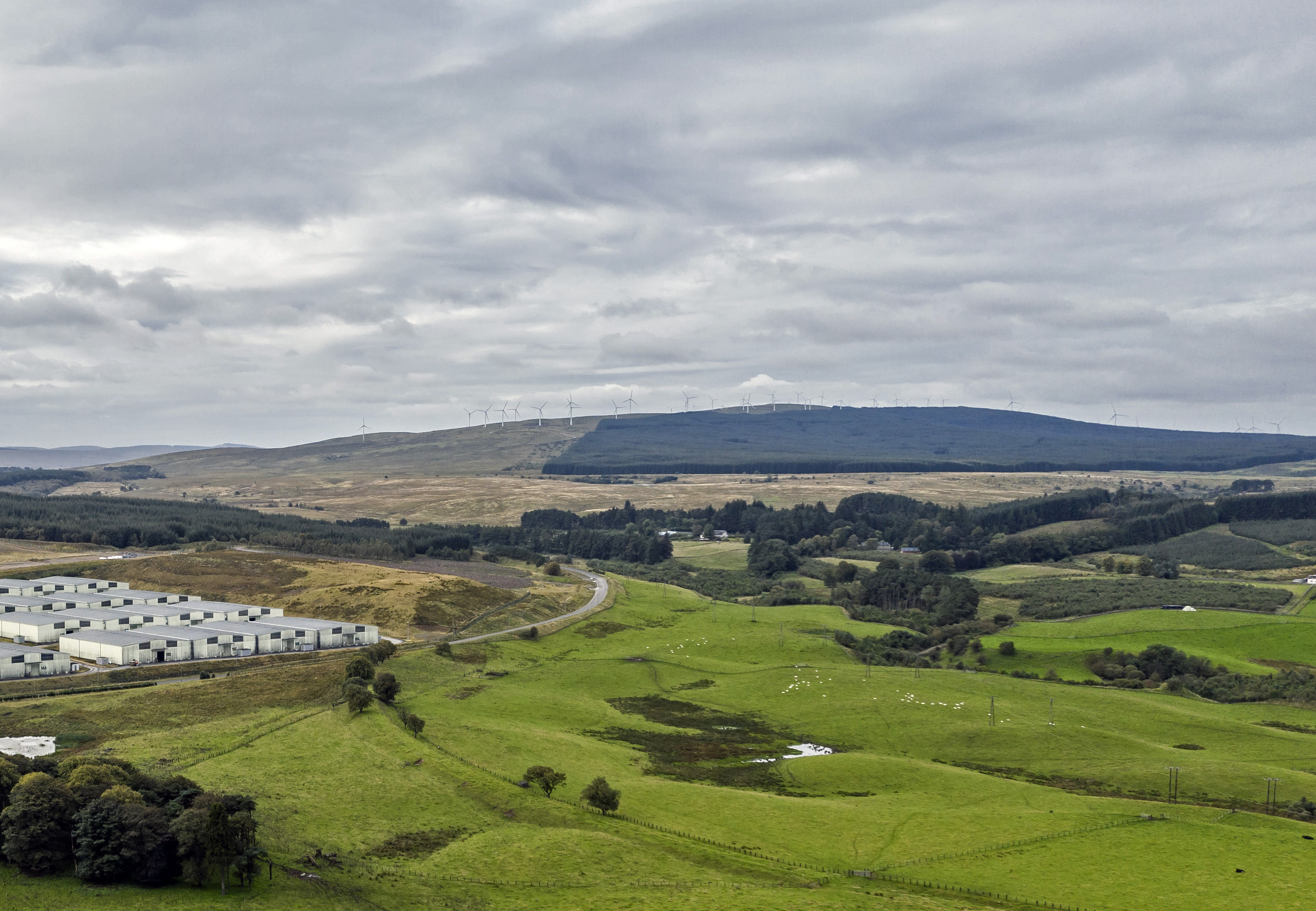 View of wind turbines on a hill