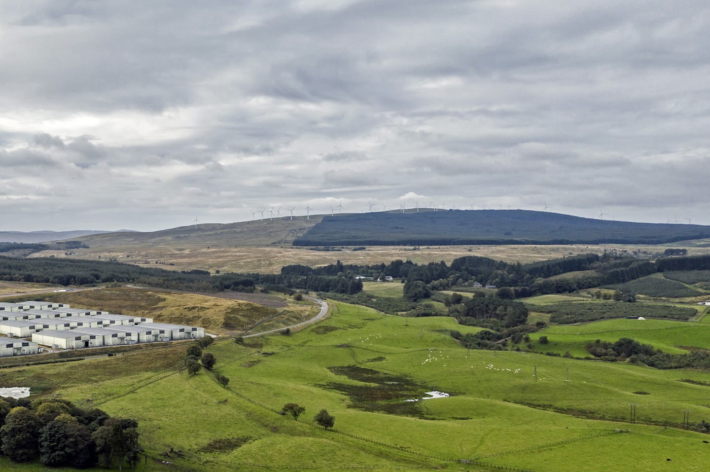 View of wind turbines on a hill