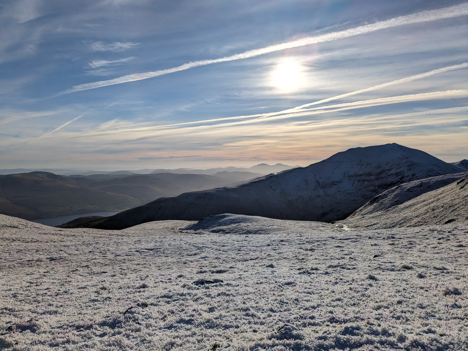 Hills with blue sky and sun