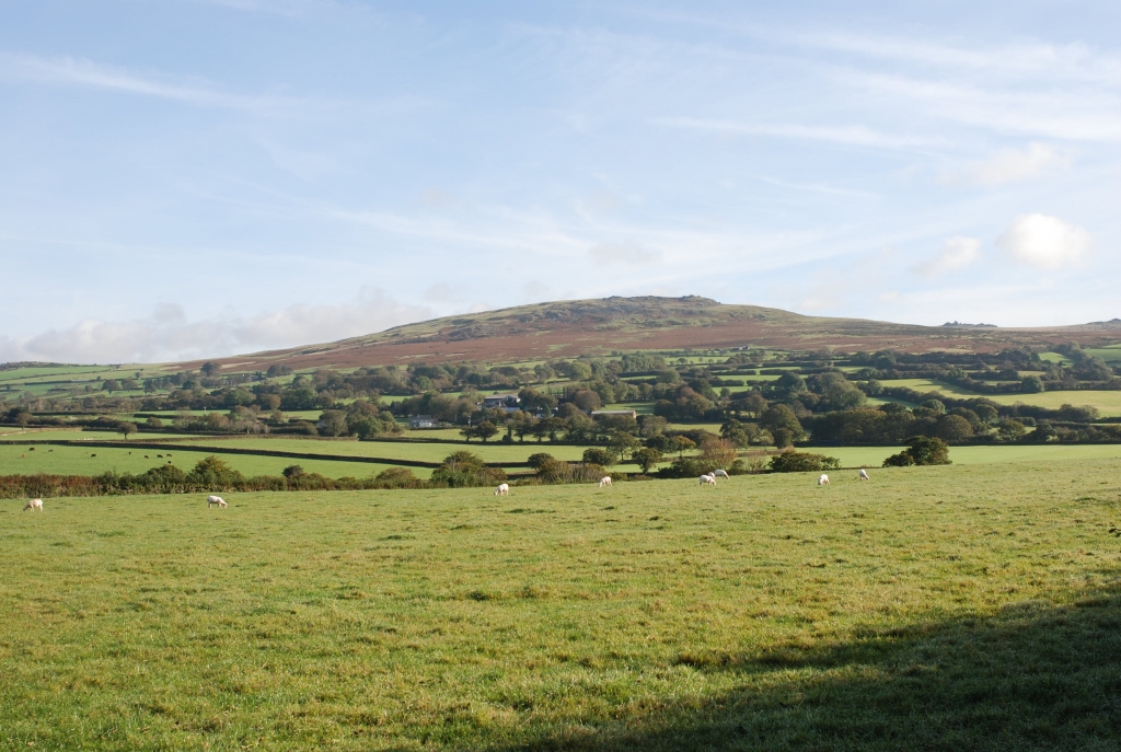 The moor grades down into an intricate landscape of medieval farmland