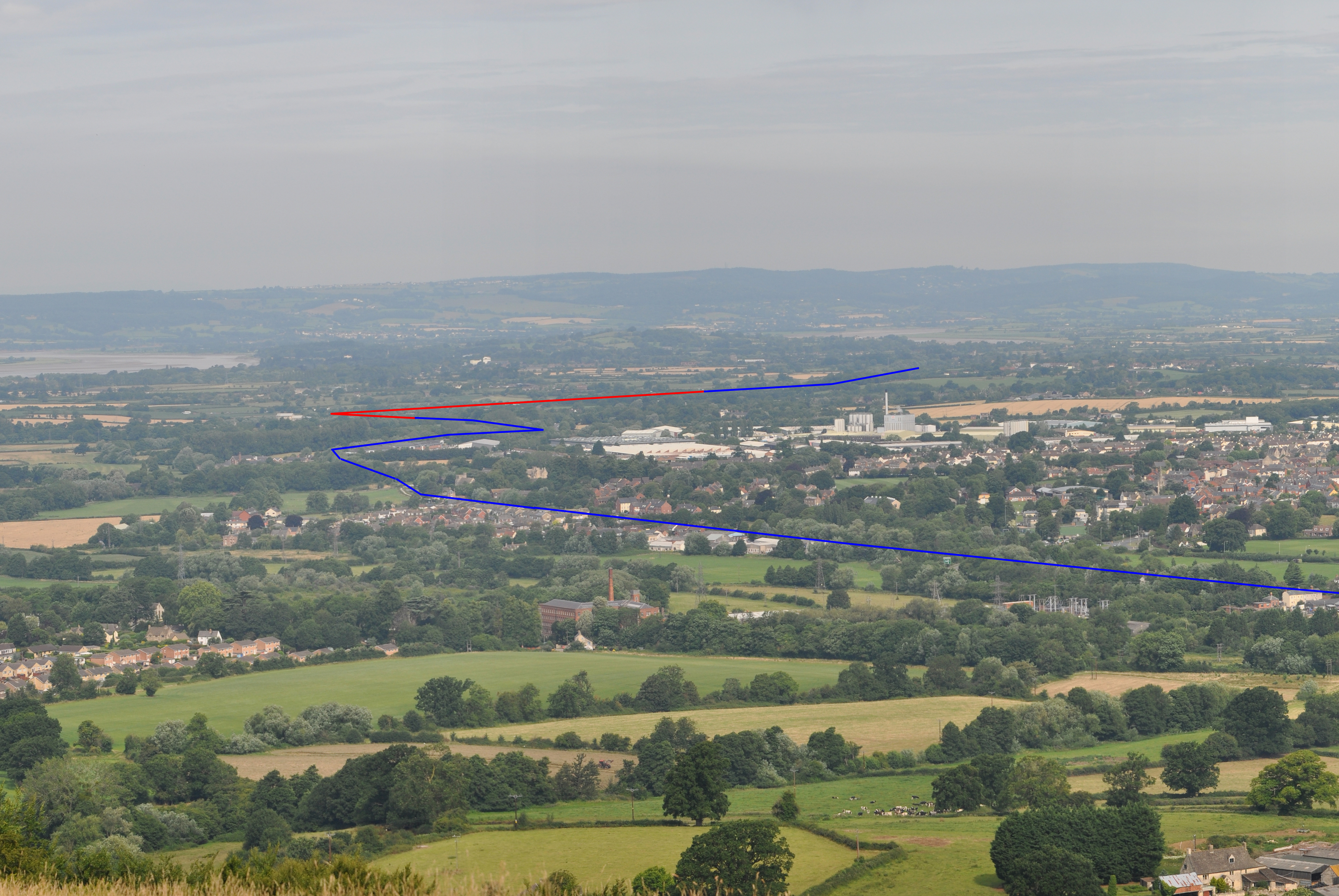 a landscape with a city and trees