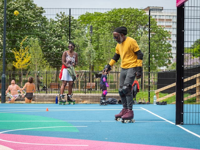a man on roller skates on a court