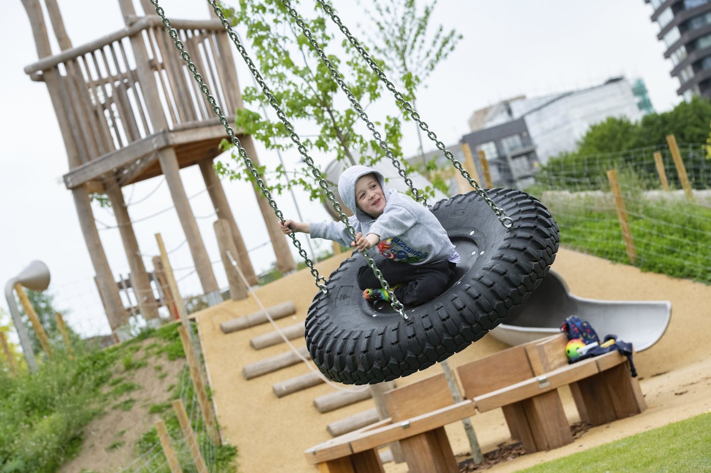 a child on a tire swing