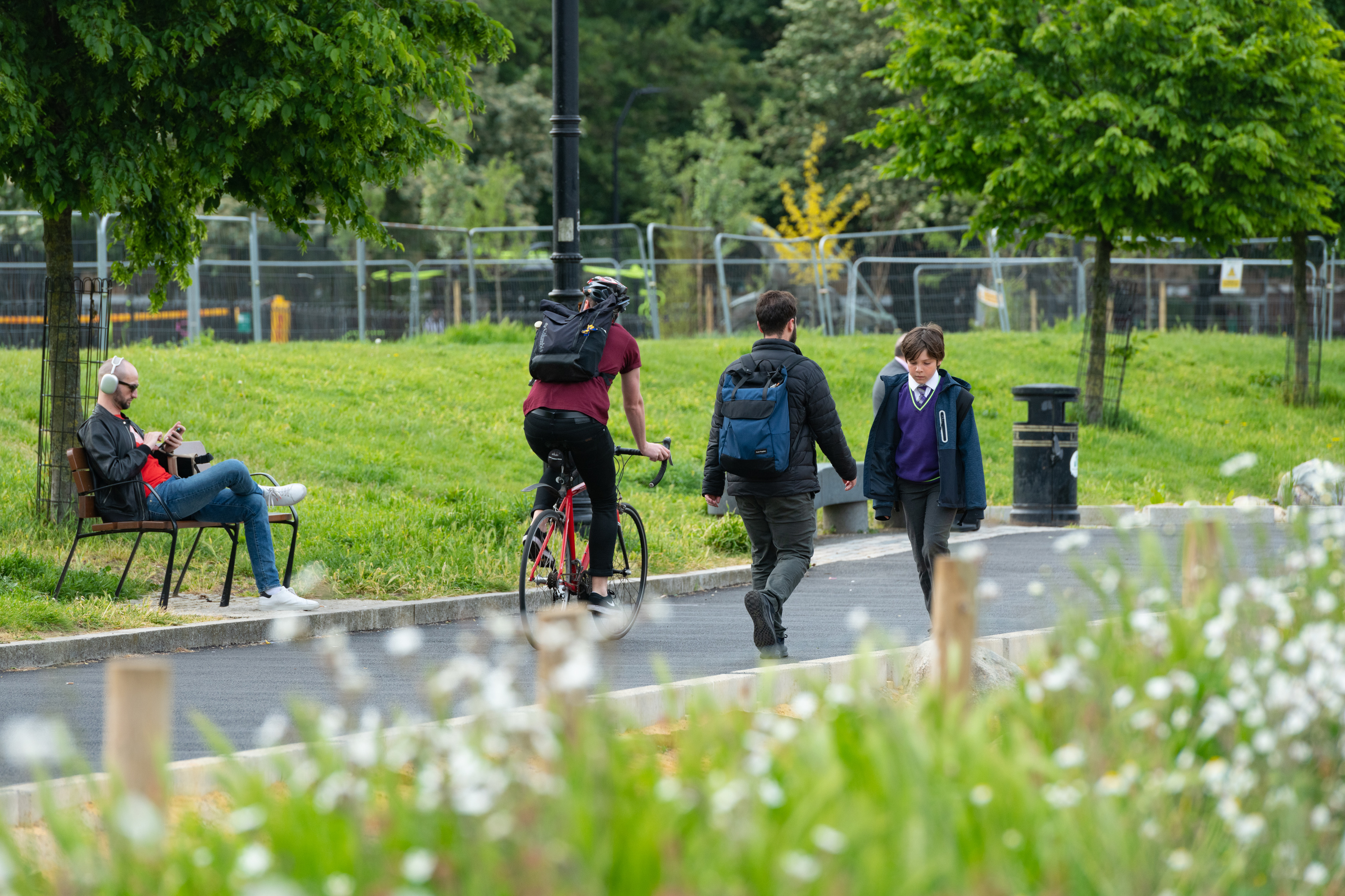 a group of people walking on a path