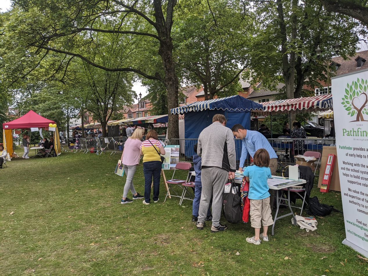 a group of people standing in a park