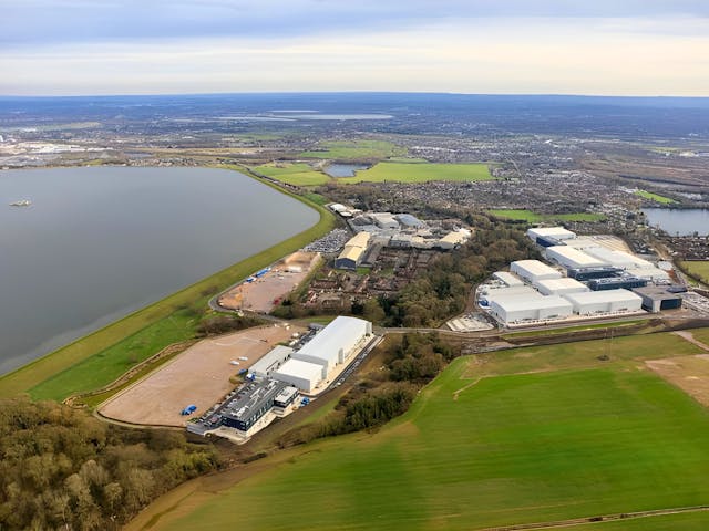 an aerial view of a large body of water and buildings