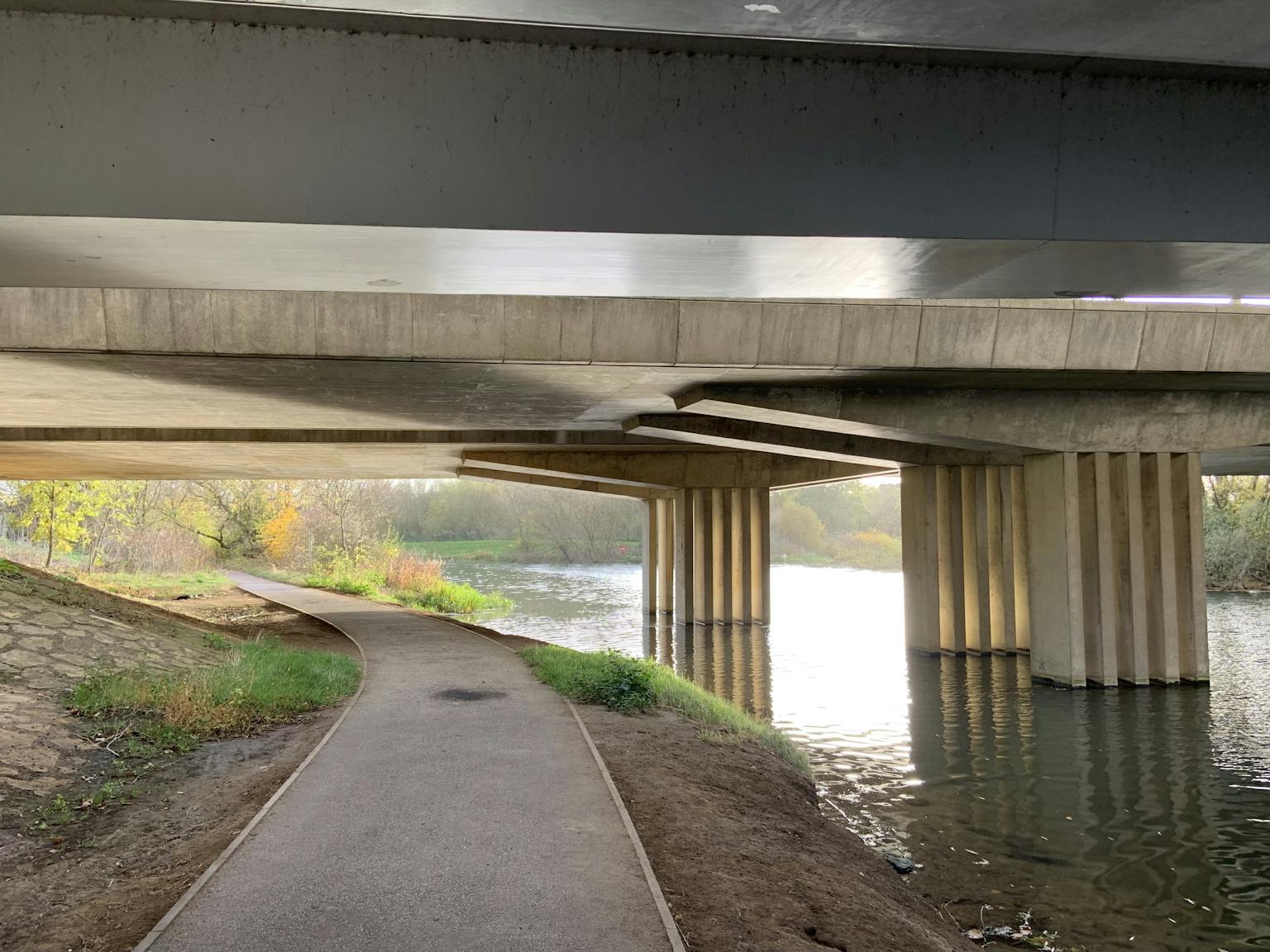 a walkway under a bridge