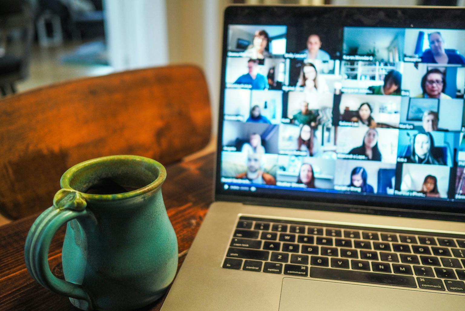 a laptop and a mug on a table