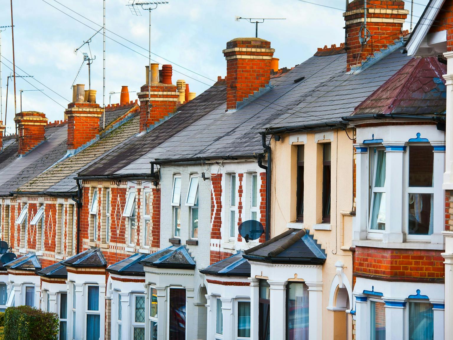 a row of houses with chimneys