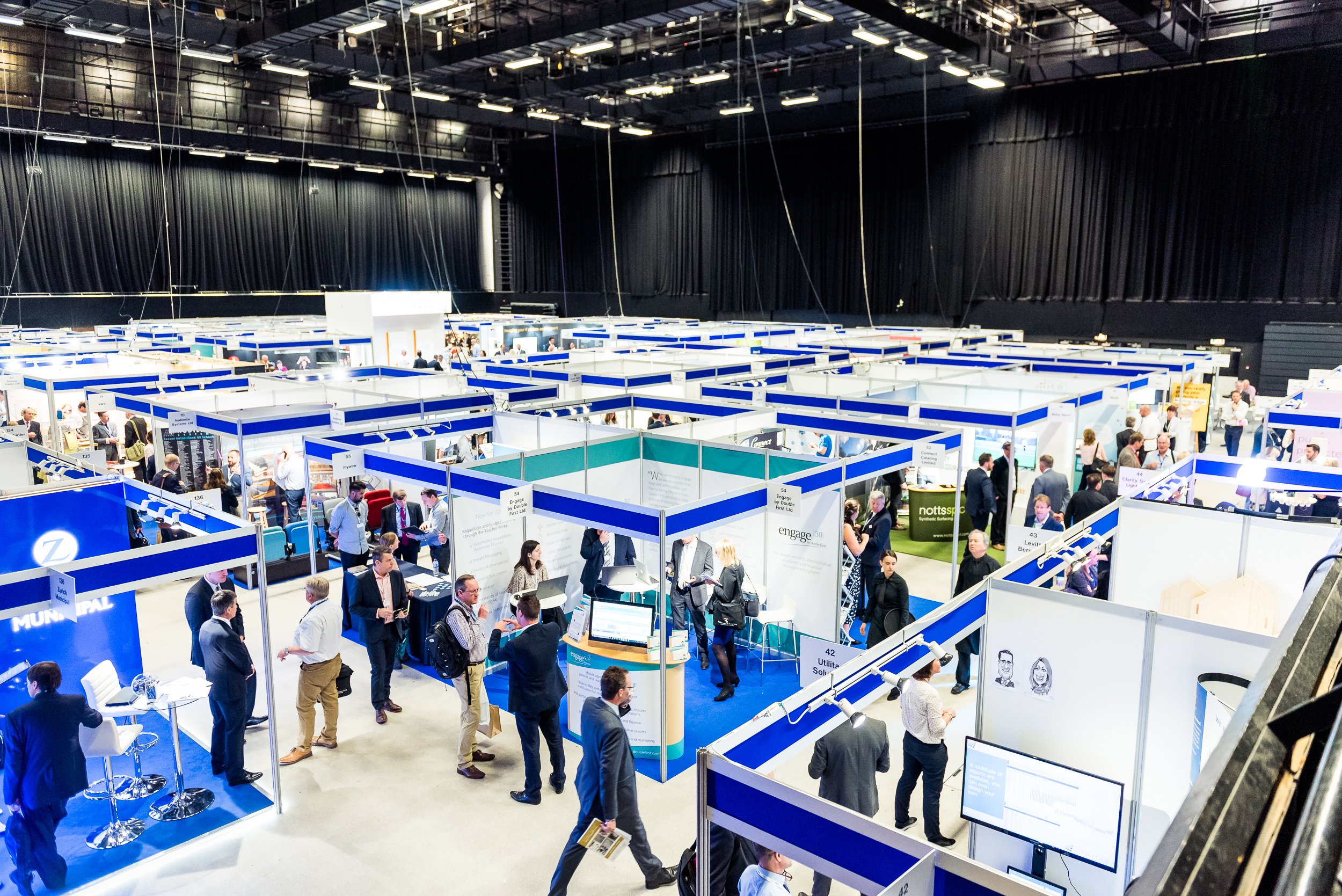 a group of people in a large room