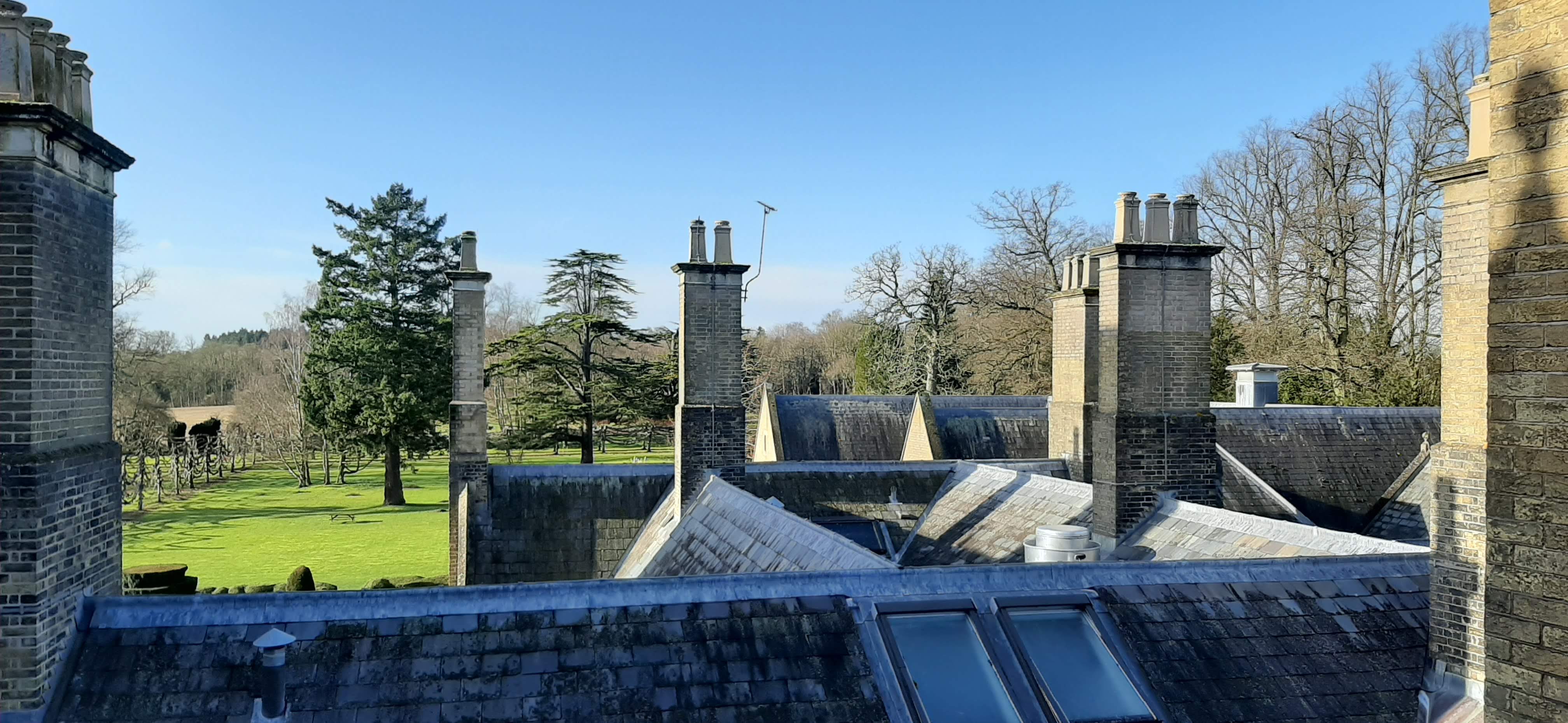 a roof of a building with chimneys
