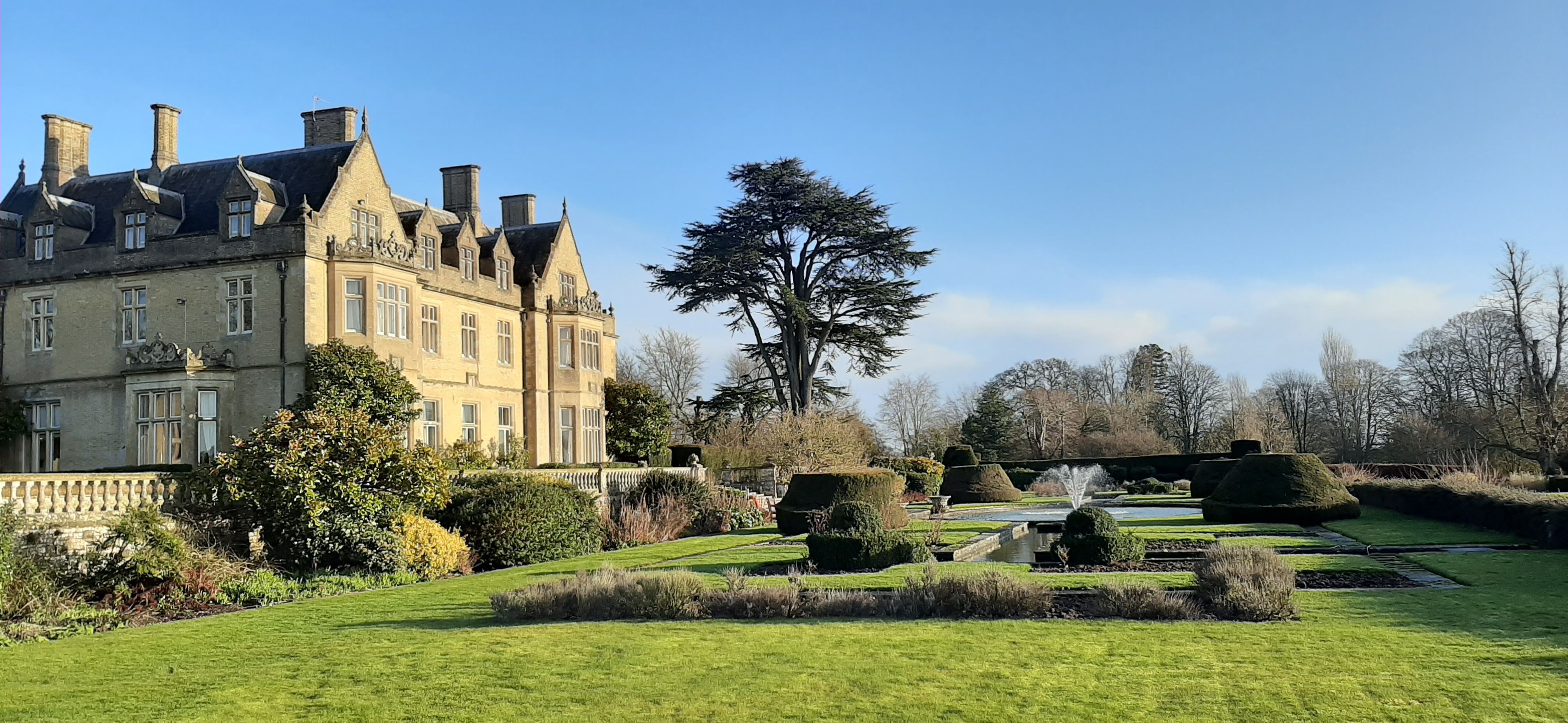 a large building with a fountain in front of it
