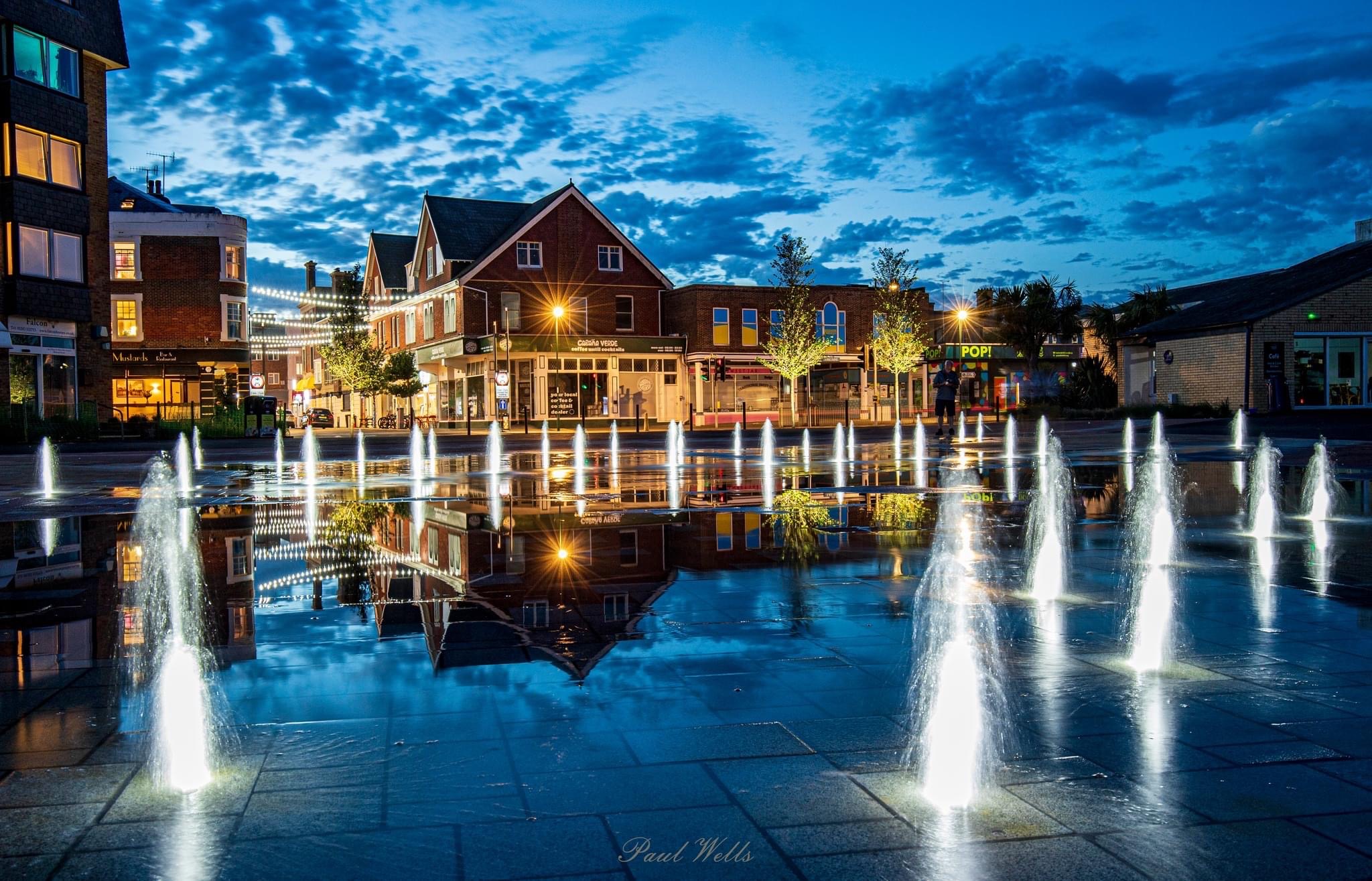 a water fountain in a town