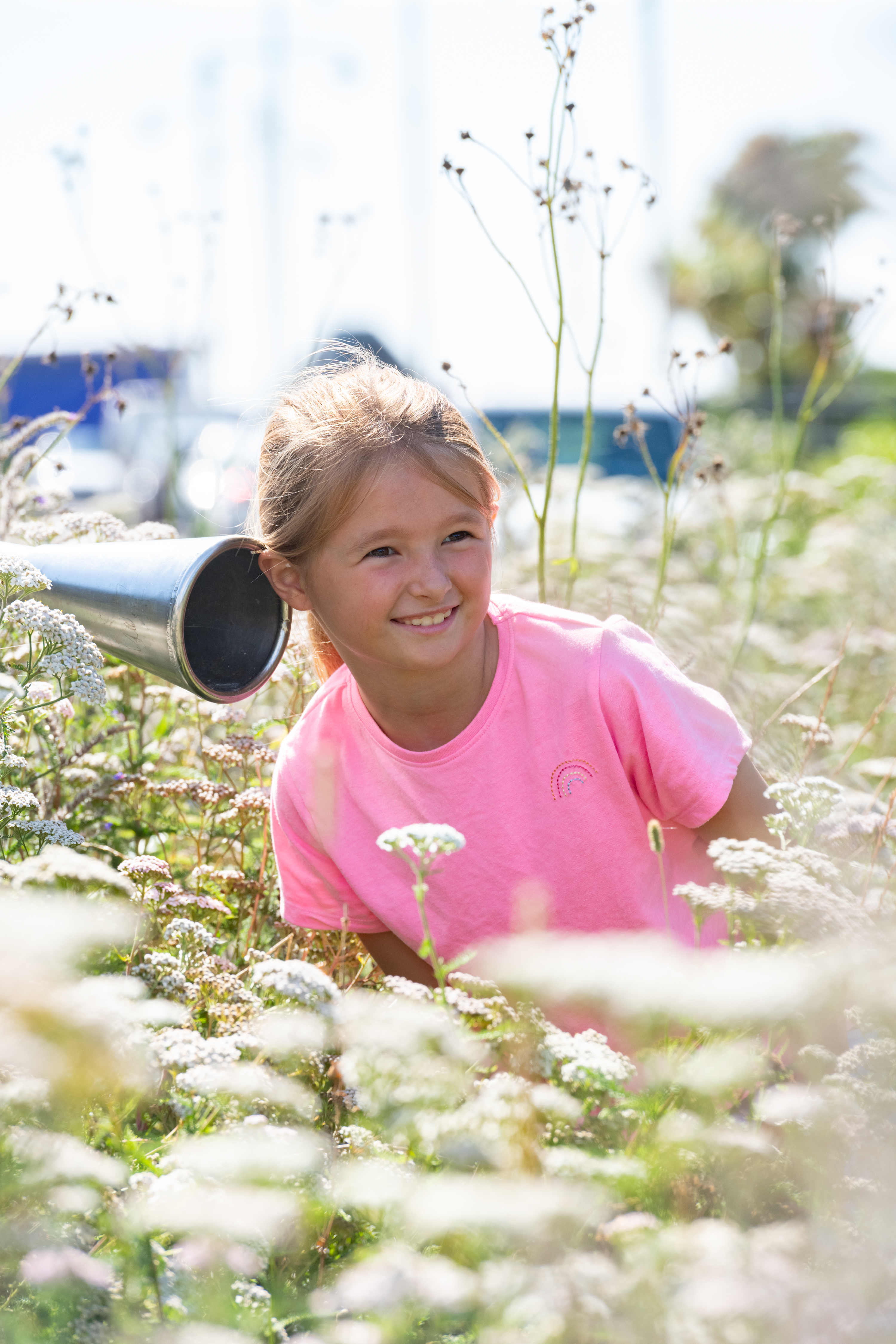 a girl in a field of flowers