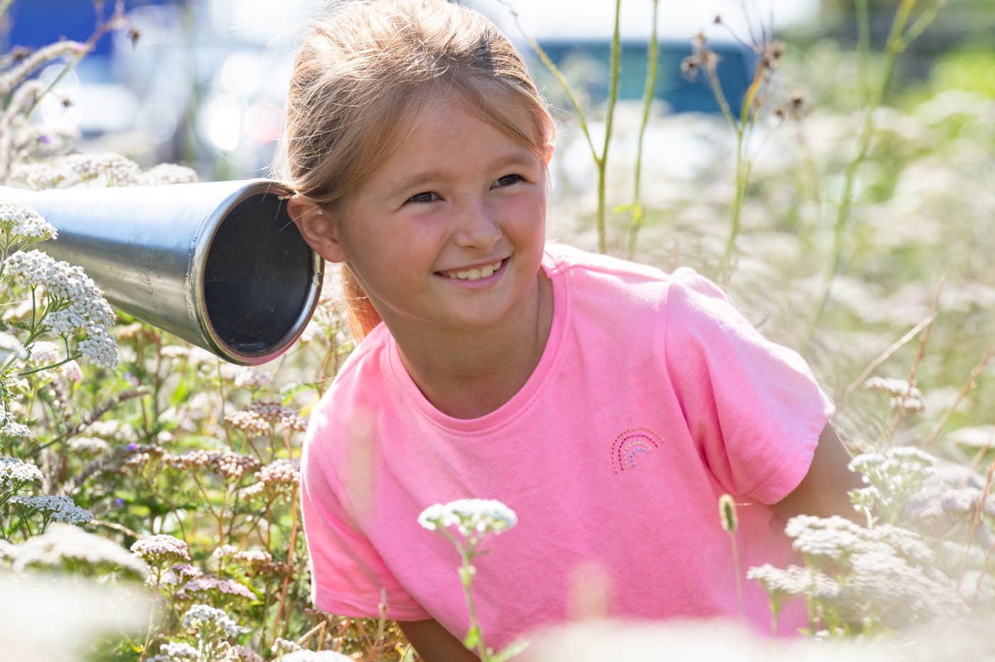a girl in a field of flowers