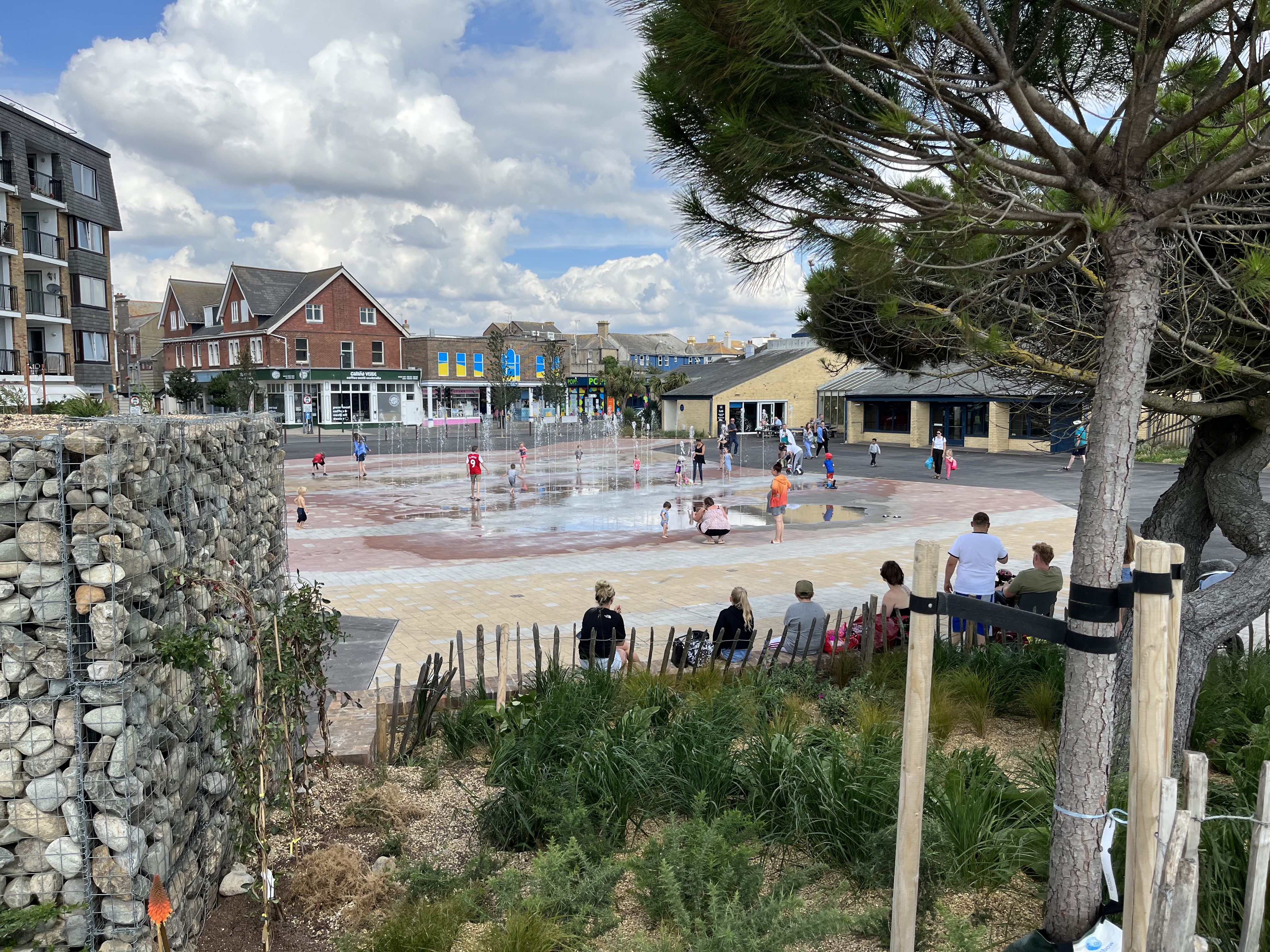 a group of people in a water fountain
