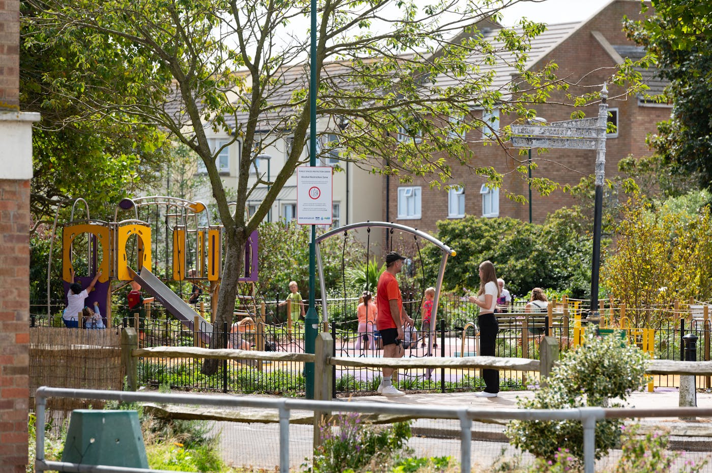 a man and woman at a playground