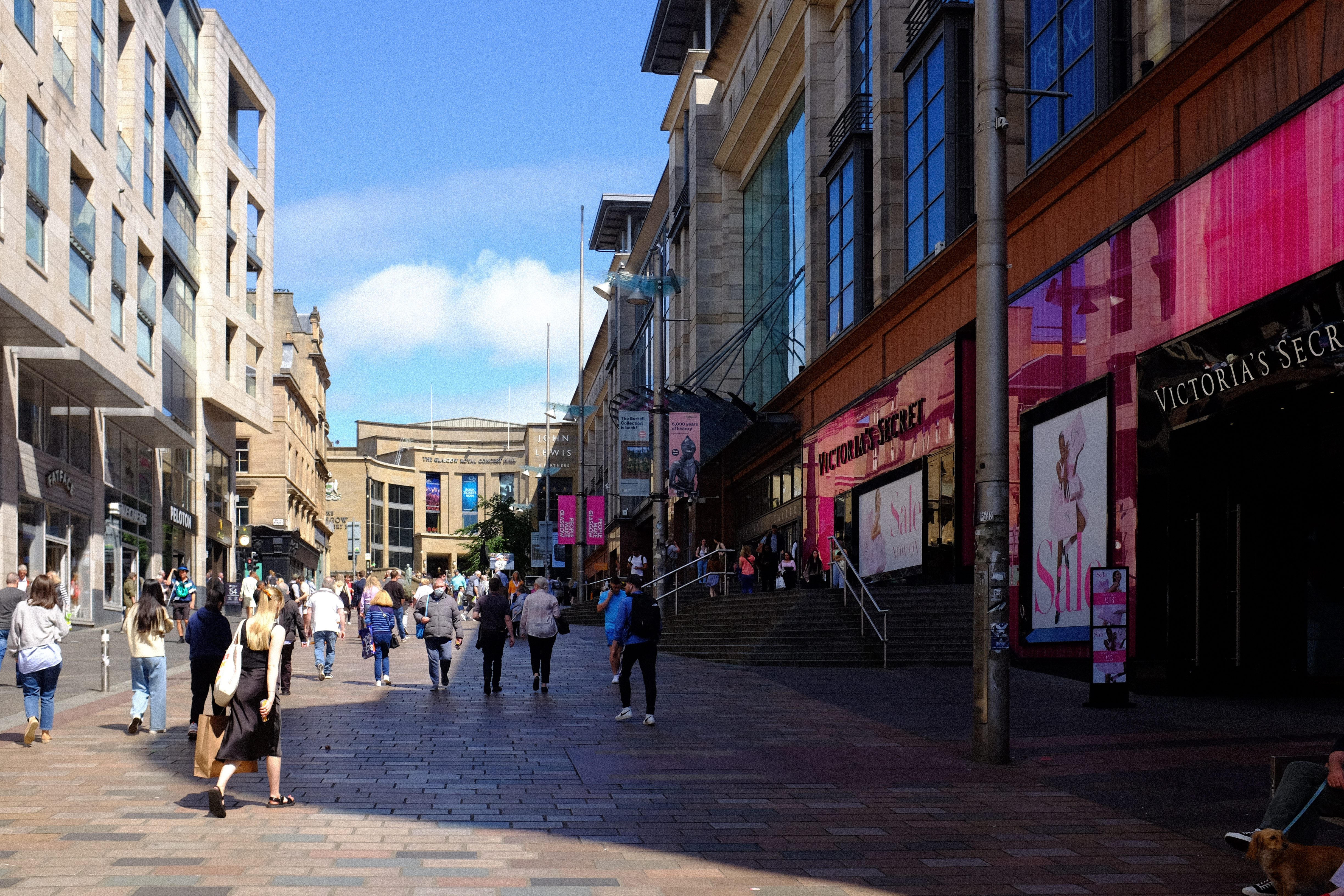a group of people walking down a street