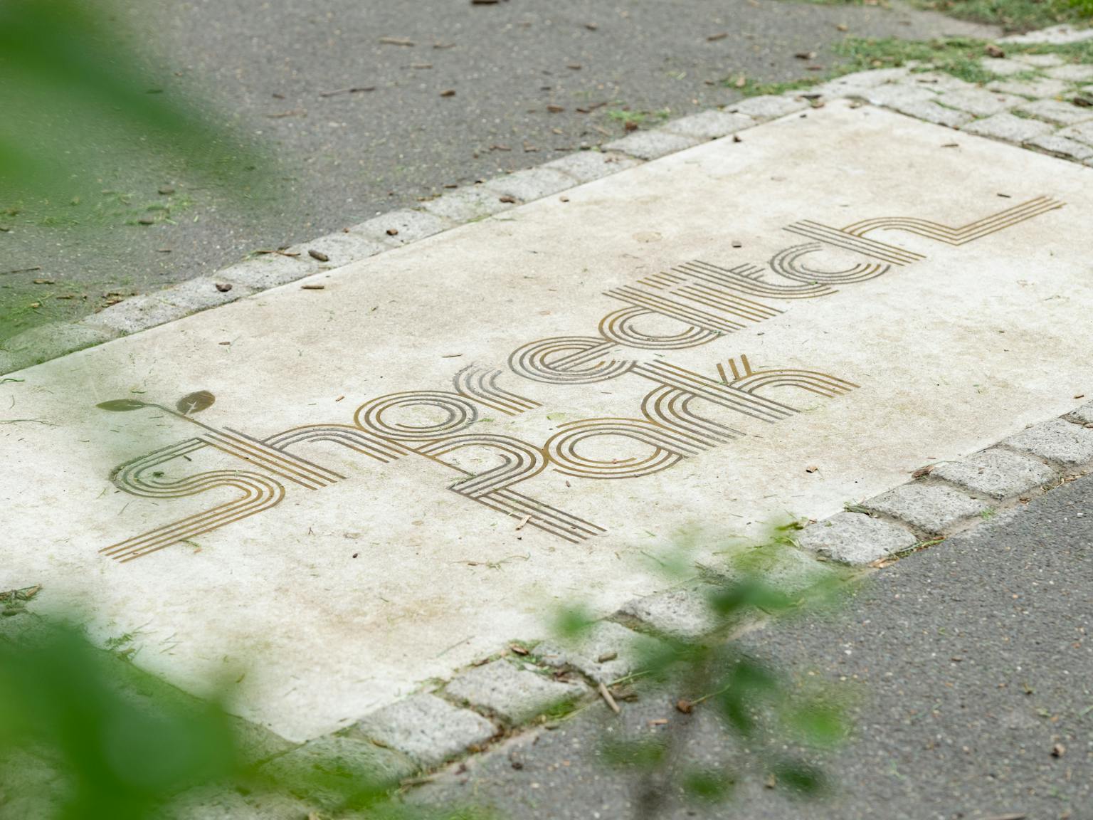 Shoreditch park sign engraved in stone