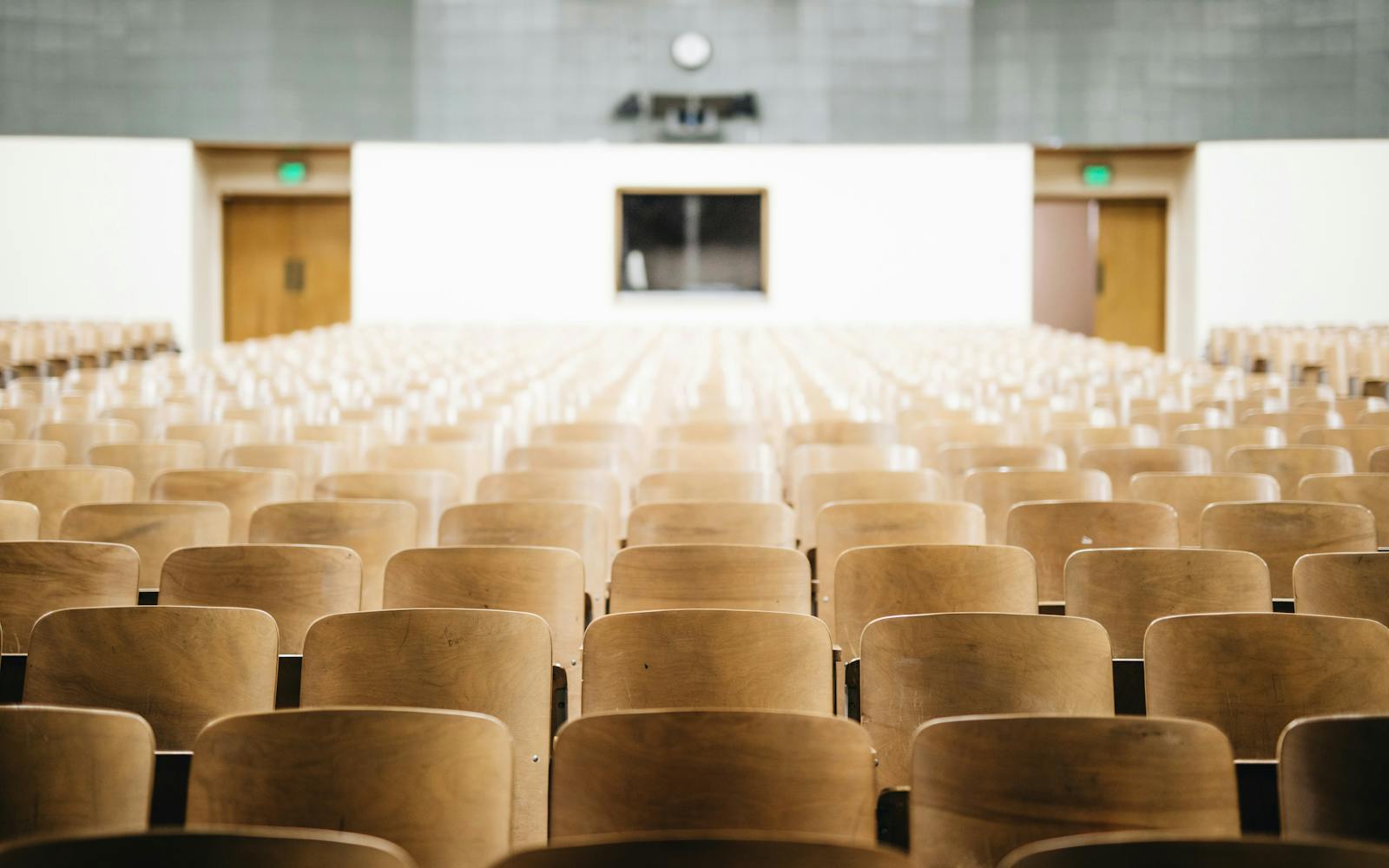 a rows of chairs in a auditorium