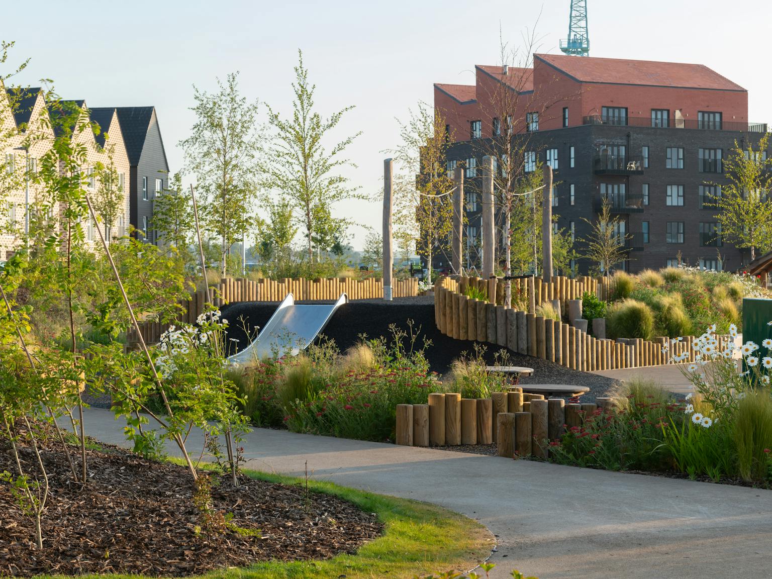 a park with a slide and a playground