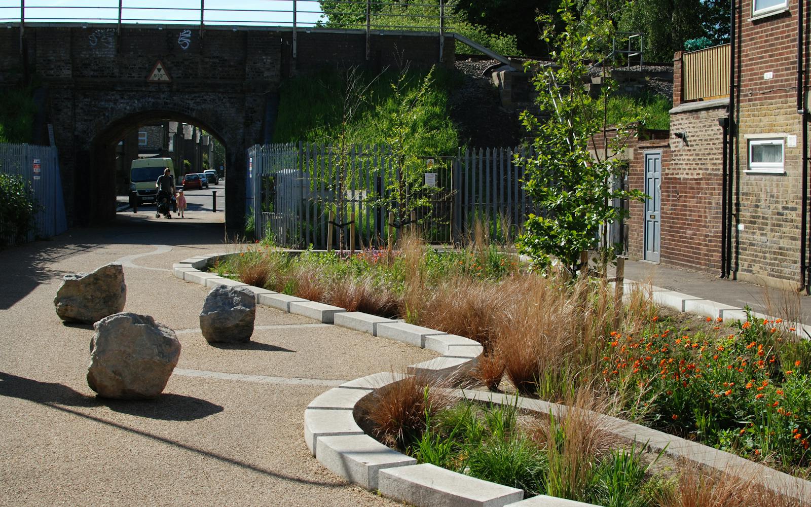 a stone path with plants and rocks