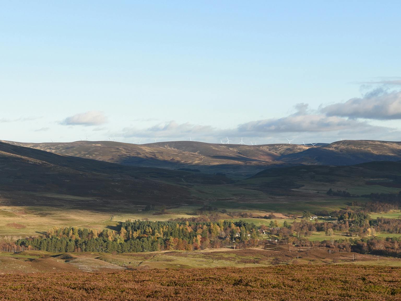 Hills and countryside with wind turbines in the distance