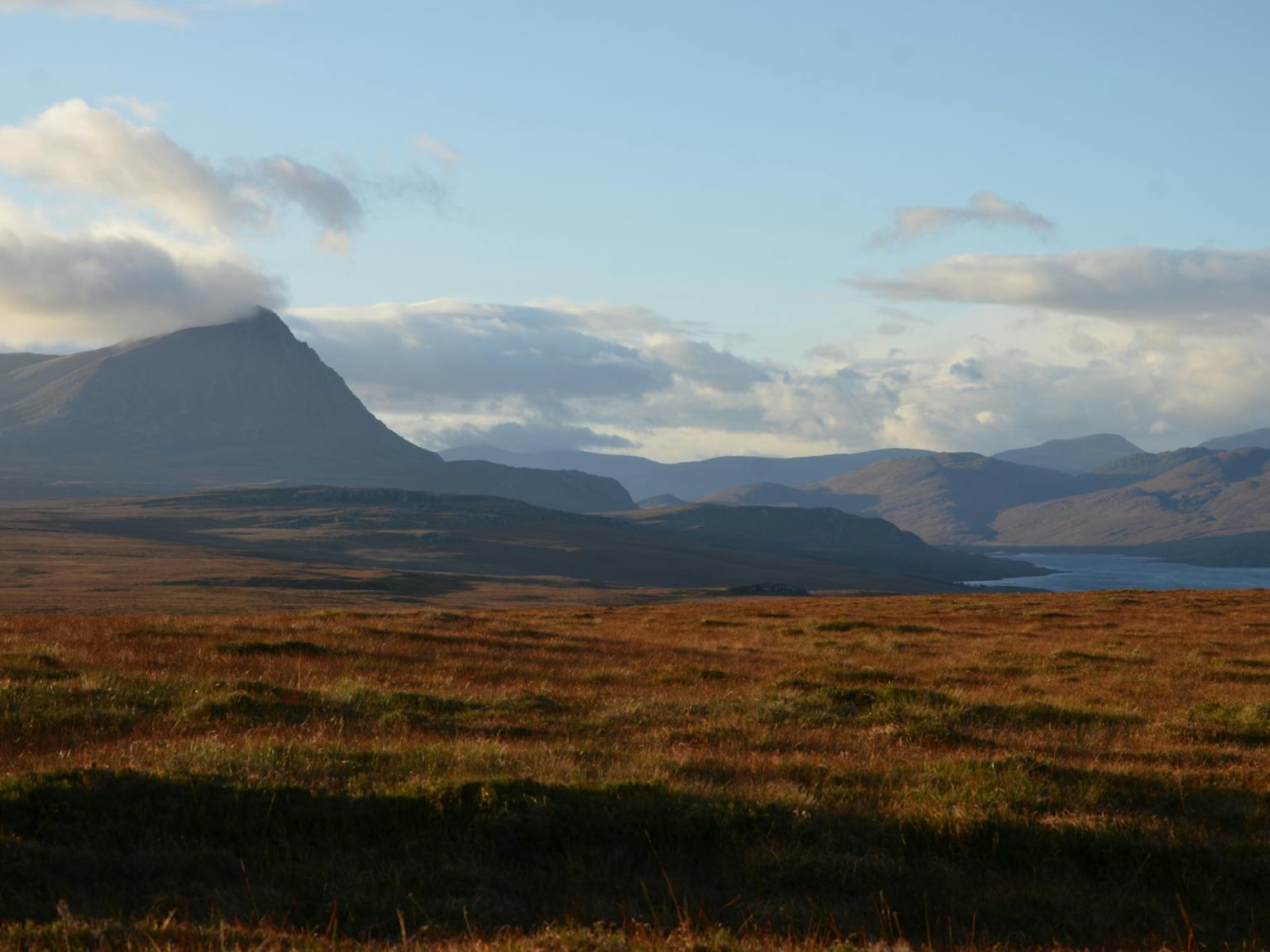 Mountain range next to water