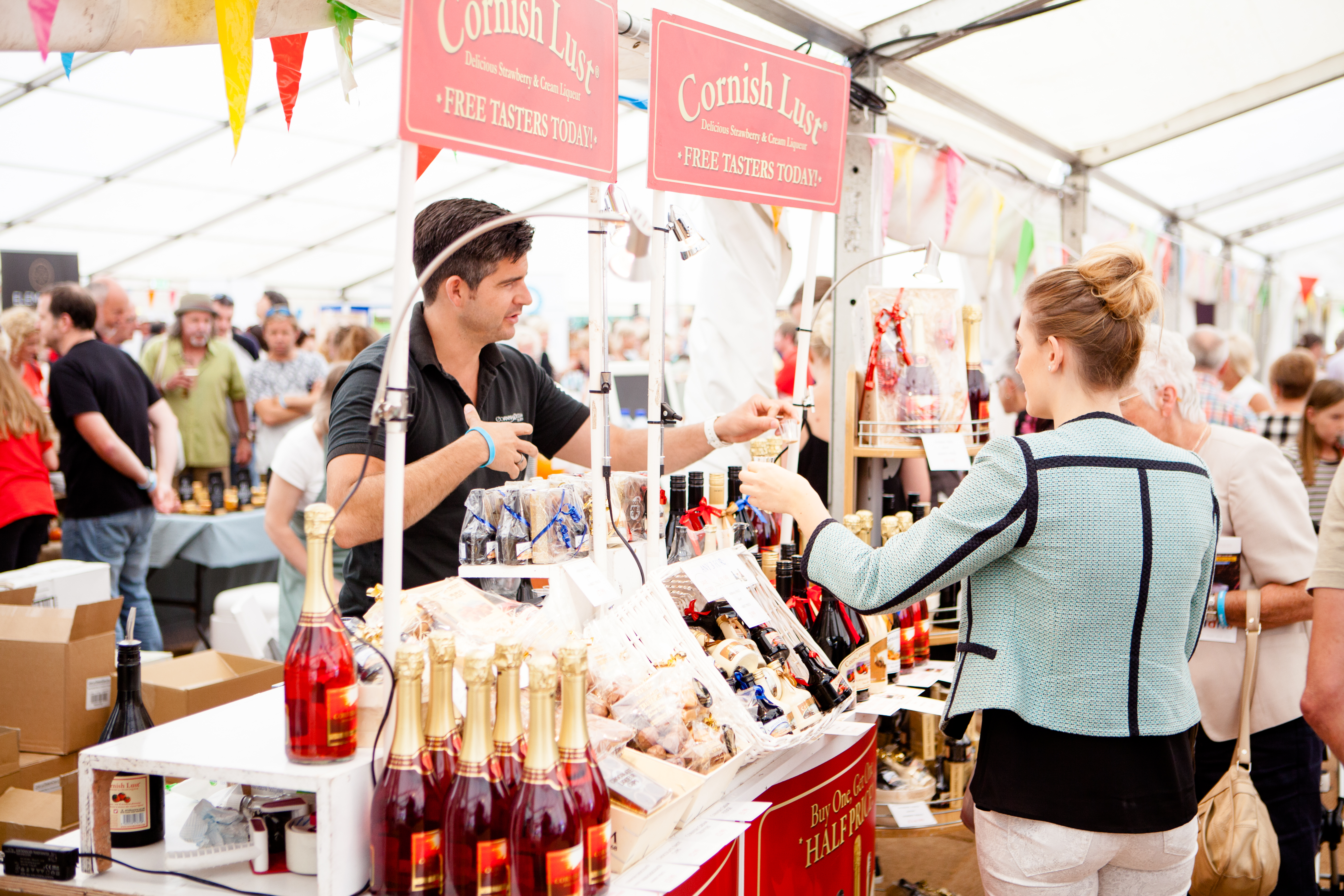 Person selling produce at stall
